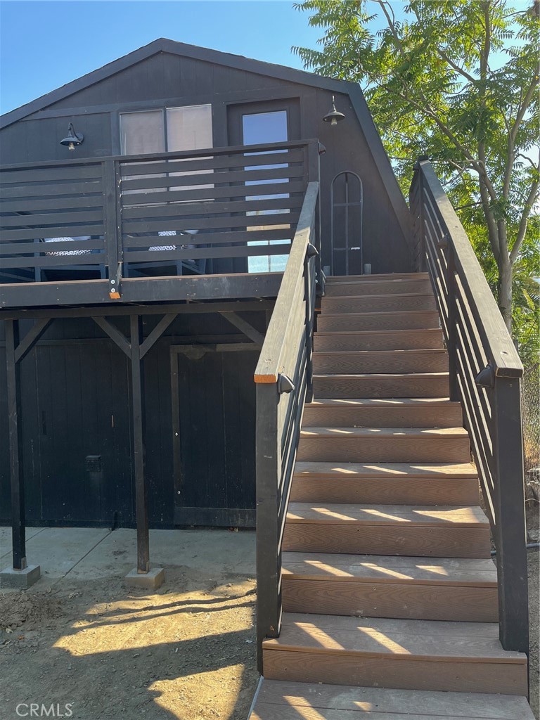 Charming large studio upstairs unit located right by the lake in Lake Elsinore! All Utilities are Included in the monthly rental price-including Internet and shared on-site laundry privileges. Unit offers kitchen area with 4-burner electric range, refrigerator, sink, and cupboards. There's an indented area for a bed and a full bathroom with the shower in the tub. Lake Views from the window and a deck area for sitting outside. Heating/Air-Conditioning unit and ceiling/light fan also offered. There is another residence on the property. Please call on pets/animals. (One small pet/animal-inside only-ok). Sorry, no yard privileges. Conveniently located just minutes from stores, shopping, and the I-15 Freeway. The lake is across the street. Uncovered tandem parking for 2 vehicles immediately in front. Covered storage area (approx 10 x 10) available for small additional fee. Non-smokers preferred.