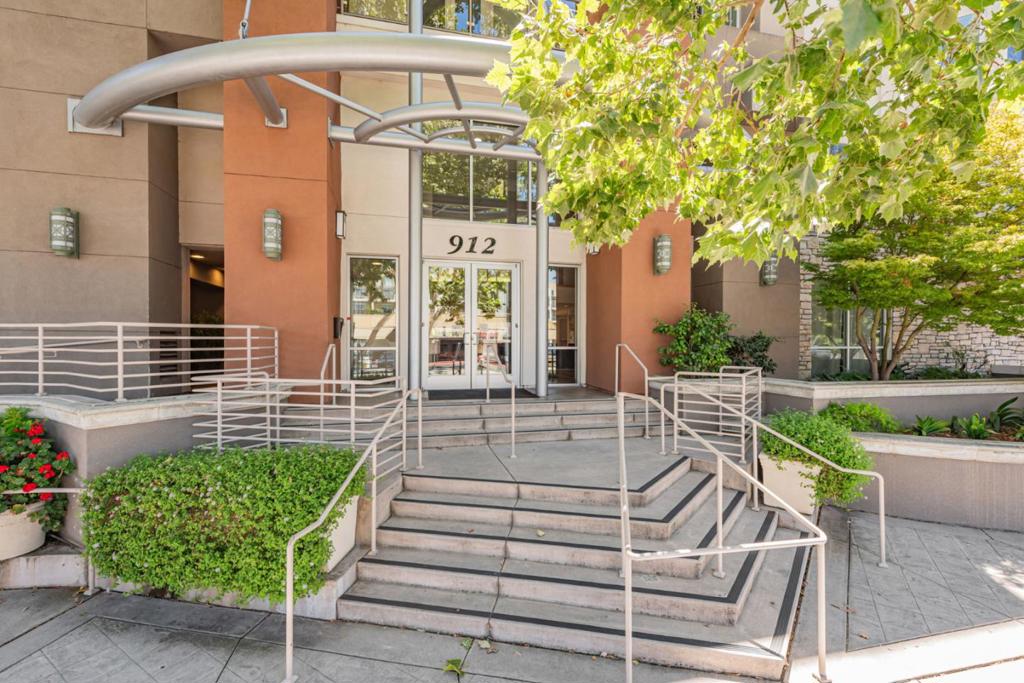 Discover this inviting home located in the charming city of Campbell. Spanning 1,765 square feet, this residence boasts three bedrooms and two full bathrooms, ideal for comfortable living. The kitchen is a chef's delight, featuring sleek quartz countertops and modern appliances, including a built-in oven range, dishwasher, microwave, refrigerator, and garbage disposal. The open dining area is seamlessly integrated into the living room, perfect for gatherings. Additional amenities include high ceilings and a spacious walk-in closet, enhancing the home's appeal. Cozy up by the fireplace on cooler evenings, adding ambiance to the living space. The property features durable laminate flooring throughout, combining style and functionality. Convenience is paramount with an in-unit washer and dryer for all your laundry needs. The home falls within the Campbell Union Elementary School District. With central AC and forced air heating, this home ensures comfort year-round. A generous three-car spaces in the community garage completes the offering.