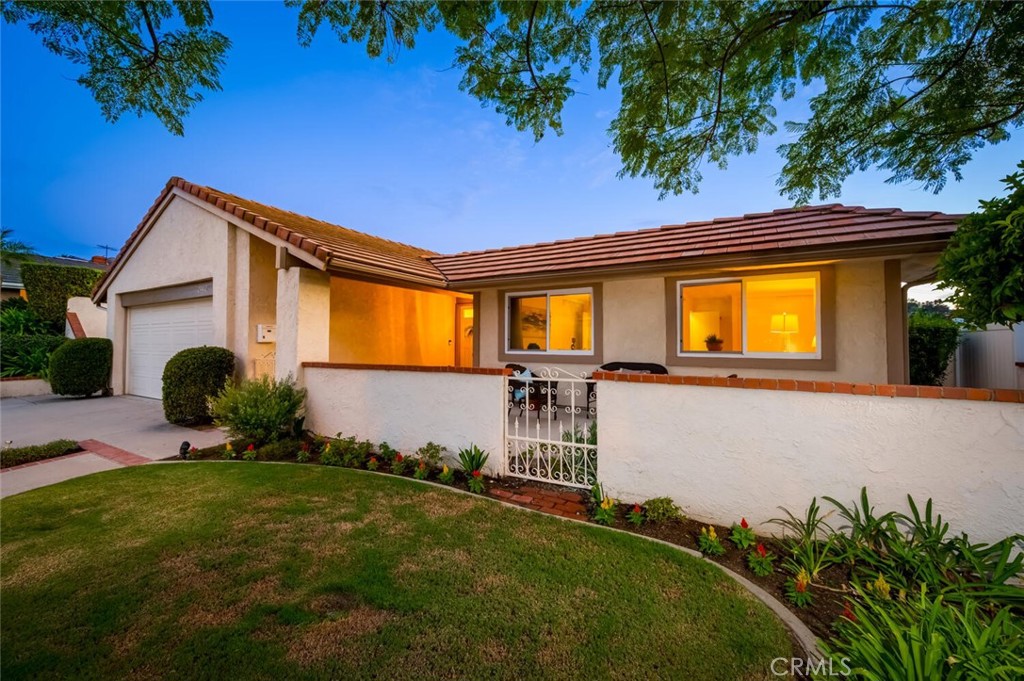Mid Century Modern, Single Story Home with large, lush backyard and generous patio improved over the years by an immaculate original owner. Featuring 4 bedrooms (a spacious primary suite, 2 oversized secondary bedrooms, and a standard size bedroom configured as an office), 2 full baths, an open concept kitchen/family room with hearth, a spacious living and dining room accented by an oversized sliding glass door & window allowing abundant natural light and a seamless connection between indoor and outdoor living. Spacious 2 car garage with direct access and storage, newer hardscape, windows, furnace, A/C unit and water heater, this home has been meticulously maintained. Excellent Schools and close proximity to shopping, parks and the community center as well as an easy commute to 5 freeway and toll road.