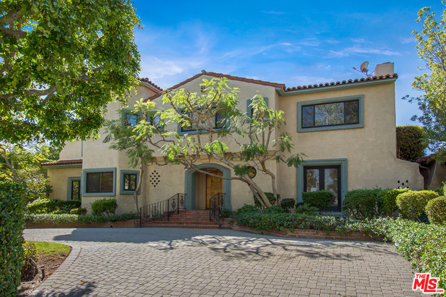 Elegantly situated in the heart of Beverly Hills sits this 2 story Mediterranean home w/ architectural details, 5 bdrms, 6 ½ bas & an inviting GH w/ add'l bedrm & bath. Enter thru the dramatic 2 story foyer to the beautifully appointed living room w/ frplc & music alcove, family/billiard rm w/ built-in book shelves & frplc, professional step-up bar & the formal dining rm that opens to the lushly landscaped bckyrd. Remodeled kitchen & adjoining den/brkfst area w/ French drs to the bckyrd, sunroom & an add'l bedrm suite complete the downstairs. Upstairs features a generous master bedrm w/ dual bathrm areas and walk-in closets & 3 add'l en-suite spacious bedrms. The sun filled private bckyrd features covered & uncovered patios, a sparkling pool/spa, a large grassy play area, covered sandbox & a detached GH w/ living & dining areas, kitchenette, bedrm & bath. The 2 car garage w/ work rm & pool bath complete the auxiliary structures. Come experience the grand essence of Beverly Hills.