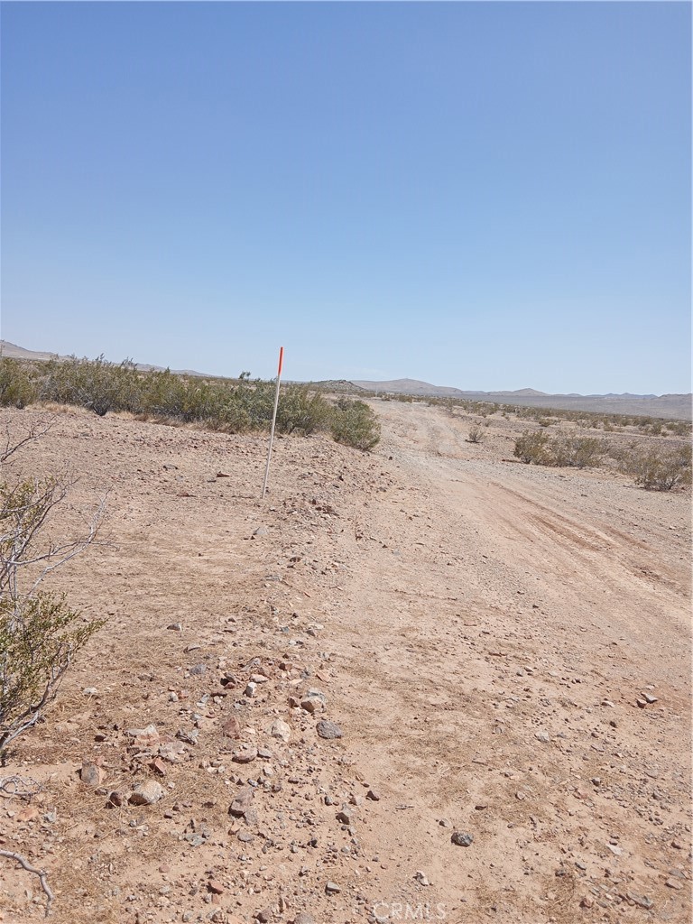 This 2.01 acre parcel is located in Helendale between Victorville and Barstow in San Bernardino County. 19 miles from Victorville, 42 miles from Barstow and 4.6 miles from Helendale. The property is close to Silver Lakes, a HOA Community with over 3000+ homes. A 27 Hole Golf Course, 2 Lakes and so much more. The property has potential for just the right buyer. You can make it your RV and camping getaway spot, bring the off road toys or star gaze in the peace and quiet for miles. Zoning is RC (Resource Conservation) This zoning district allows for open space, single homes on large properties and
comparable uses. Buyers to contact the County of San Bernardino Planning Dept.to verify uses and permits for your future plans on this property. Use the APN# for your inquiries. Some residents have put in their own well for water, propane tanks for gas and electricity. Solar Panels have been used also.