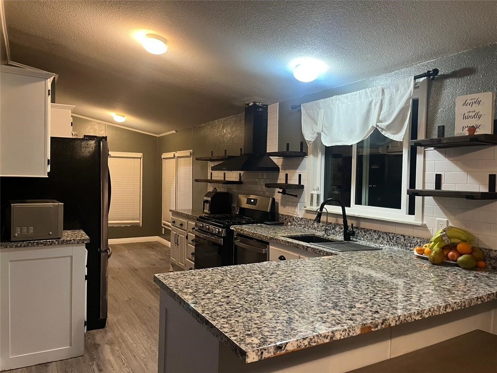 Located in the Sierra Estates family park in Canyon Country, this 4-bedroom, 2-bath manufactured home offers 1,680 sq ft of living space on a spacious corner lot. Features include an open floor plan with vaulted ceilings, a large kitchen with ample storage, a bonus den, and an indoor laundry room. The primary suite includes a private bath, and three additional bedrooms provide flexibility for family, guests, or office space. Recent updates include fresh paint and flooring, central heating and air, and a covered two-car carport. The fenced yard and covered porch offer great outdoor living.