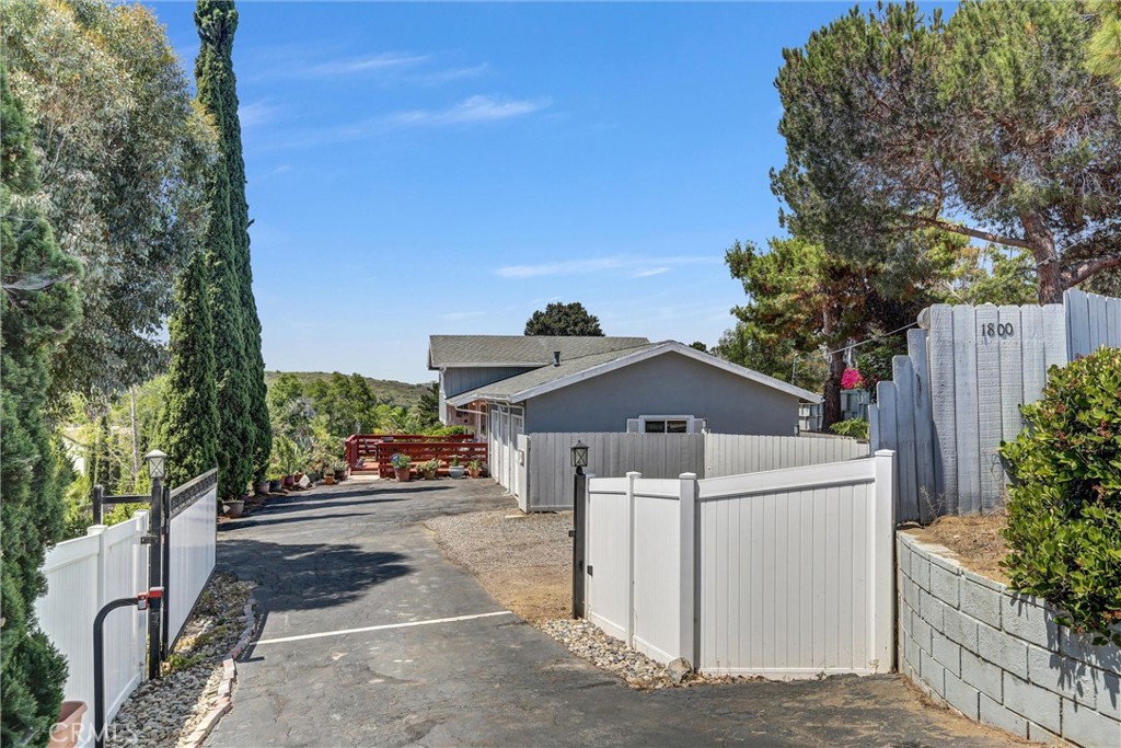 Opportunity Knocks! 1st Time on Market in 40+ Years — Rare Vista Estate with Two Parcels
Back on the market after more than 40 years, this charming tri-level 3-bedroom + den (optional 4th bedroom), 2.5-bath home offers over 1,700 sq. ft. of living space on a sprawling 1.11-acre lot, with an additional available 1.65-acre vacant parcel — if both included in the sale the combined price is $1,999,800. Purchase together or separately!
Nestled in a peaceful, semi-rural setting just minutes from shopping, dining, and coastal attractions, this rare Vista property blends the tranquility of country living with urban convenience. Accessed via a private gated driveway off Sunset Drive, this beautifully maintained home exudes warmth and character throughout.
Inside, you'll find:
Gorgeous hardwood floors throughout the main level
A cozy living room with a gas fireplace and convenient guest half bath
An immaculate kitchen featuring Corian countertops, tile backsplash, and stainless steel appliances, including an electric cooktop, wall oven, and microwave/convection oven
An adjoining dining area perfect for family meals
Three spacious upstairs bedrooms served by a beautifully remodeled hall bath
A lower-level family room and an attached den/optional 4th bedroom with a private bathroom and walk-in shower — ideal for guests, extended family, or a home office
Step outside and enjoy a large custom-built wooden front deck, perfect for entertaining or simply relaxing under the stars. A rear deck accessed through a custom wooden sliding glass door offers even more outdoor living space.
The fully fenced yard ensures privacy and security, while the 3-car garage and ample RV/boat parking provide plenty of space for all your vehicles and toys.
Bonus Value:
Two parcels included — APN 169-021-12 (1.11 acres with home) and APN 169-021-11 (1.65-acre adjacent vacant lot)
Ideal potential for building an ADU, expanding your private oasis, or developing further
Endless opportunities for gardening, hobby farming, or multigenerational living
Don’t miss your chance to own this one-of-a-kind Vista property with development potential in a prime location. Schedule your private showing today!