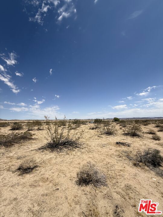 SELLER FINANCING AVAILABLE. Unlock the potential of 4.68 acres of high-visibility commercial land in booming Joshua Tree one of Southern California's most sought-after desert destinations. With over 330 feet of frontage on Highway 62 and zoned JT/CS (Service Commercial), this parcel is ideal for investors, developers, or end-users looking to capitalize on the area's growth and tourism draw. This parcel comes with valuable groundwork already in place, including a 4x4 roadside sign (installed and rentable for ad revenue), concept renderings, and a verified zoning analysis to accelerate your development timeline.