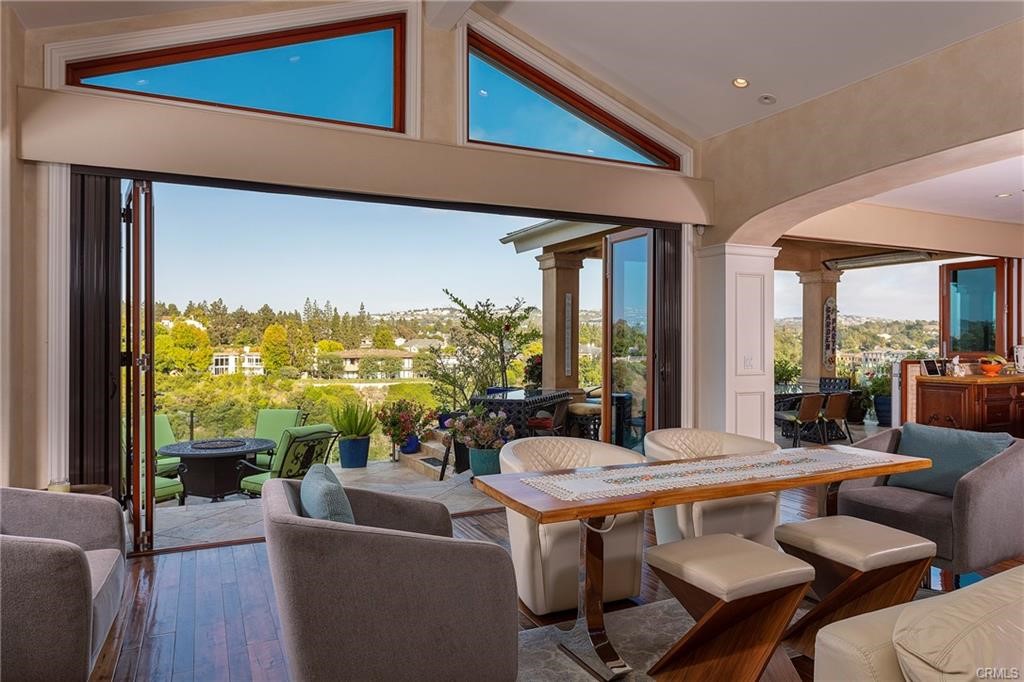 For anyone seeking a luxury lifestyle in the heart of Newport Beach, this property is the one for you. Overlooking the second fairway of Big Canyon Country Club with unobstructed panoramic views, this home was impeccably remodeled in 2008. Unfold the accordion doors spanning the entire back of the home, and indoor-outdoor living and dining instantly materialize, providing a front-row seat to spectacular July 4th firework displays. With a kitchen worthy of "Top Chef," over-sized wine closet, fully integrated audio system and an open floor plan, entertaining is raised to the highest level. The home is outfitted with two master bedrooms (one down, one up) and one secondary ensuite-bedroom with twin Murphy beds built in. Solar panels are installed, keeping energy costs to a minimum. Just across from the world-famous Fashion Island, shopping, fine-dining and entertainment are mere moments away. If great schools are a concern, the Newport-Mesa school district is one of California's finest. This home is for the most discerning individual(s) who demand the finest.