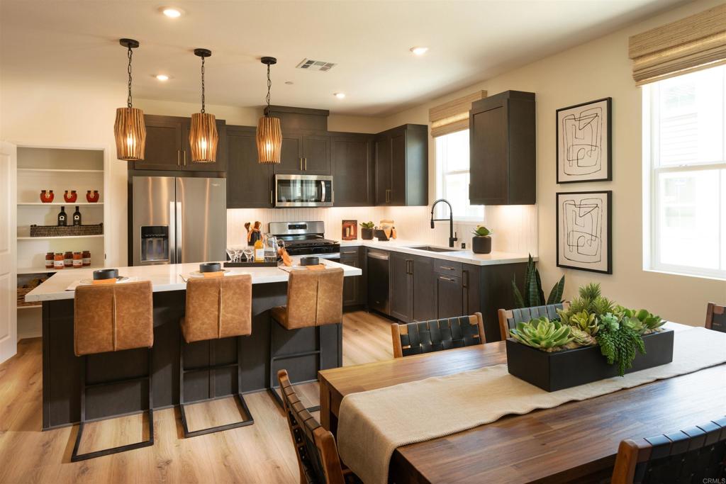 This stunning new tri-level home in the vibrant Citrus Bay community of Chula Vista is ready for move-in and packed with style. It features 2 spacious bedrooms,2.5 modern bathrooms and 1,384 square feet of living space. Enjoy a private deck, 2 -car garage and beautiful finishes throughout-including upgraded flooring, sleek white cabinets, and full kitchen backsplash. Just steps from the scenic bay and near the Luxurious Gaylord Pacific Resort, this home places you in the heart of Chula Vista with walkable access to restaurants, the Chula Vista Center Mall, and more. Beyond the home itself, the community offers a private recreational center, sparkling pool, BBQ area and a future lush park- perfect for relaxing with family and friends. Photos and videos are for representational purposes only.