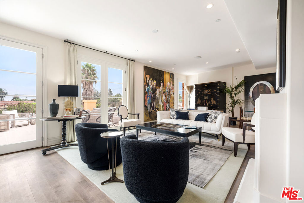 Welcome to this sophisticated 3-bedroom (or 2-bedroom plus office), 3-bath, 2,450 sq ft condo in prime Westwood. This rare residence seamlessly blends scale and style, featuring a spacious living room with a fireplace, custom art walls, and French doors that open to an expansive private terrace offering sweeping views of Century City. The formal dining area flows seamlessly into a chef's kitchen with granite countertops, a center island, and stainless-steel appliances. The serene primary suite offers a spa-like bath, a walk-in closet, and direct balcony access. A generous second bedroom suite, high ceilings, hardwood floors, and refined finishes complete the home. Located moments from Westwood Village, UCLA, and Beverly Hills, this property offers the comfort of a private home with the convenience of condo living. Includes two side-by-side parking spaces.