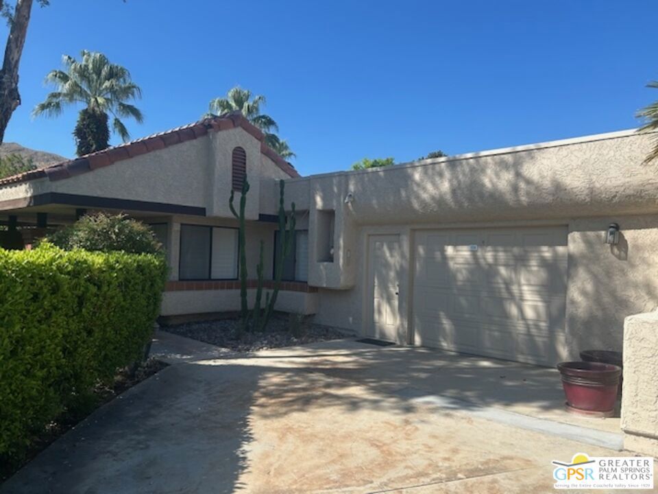 Welcome to your desert oasis in the gated community of Oasis Resort Condos in south Palm Springs. This charming end unit offers an inviting blend of comfort and luxury. With two spacious bedrooms and 2 baths, each bedroom provides a private retreat. The home is tiled throughout. The heart of this home is its large wrap-around private patio perfect for entertaining or unwinding amidst lush surroundings. Just steps away, you'll find the pool and spa, ideal for relaxation. The unit spans 1,252 square feet, featuring an open layout that includes a modern kitchen with quartz countertops and a cozy breakfast nook. Enjoy the convenience of a washer/dryer in the home. Additional amenities include a two car garage, guest parking, plantation shutters and central air conditioning. Situated in a pet-friendly, low-rise community, residents have access to a barbecue area, gym, tennis and bocce ball courts, pools; spas; clubhouse and more, all surrounded by beautifully landscaped grounds. An opportunity to enjoy resort-style living at its finest awaits you here.