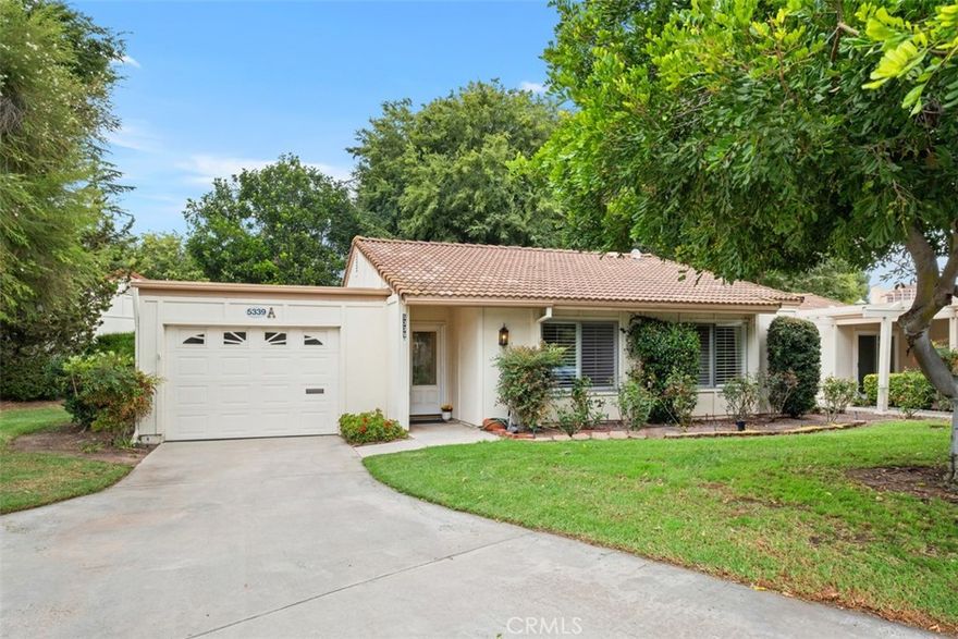 Welcome home to this charming Las Flores model, nestled in the desirable 55+ community of Laguna Woods Village. This inviting 2-bedroom, 2-bathroom residence boasts an array of thoughtful features and enhancements designed for comfortable and enjoyable living. End unit cottage-style home with no neighbors above or below.  Lovely park like greenbelt and HOA maintained lawn in front and side of home.  As you enter, you'll be greeted by a seamless flow between the attached garage, which offers direct access into the living room, and the rest of the home. Home features updated kitchen with stainless finish appliances, modern backsplash, remodeled bathrooms with designer selected tile surrounds in the showers. The additional glass enclosed patio room runs the width of the interior living space and is not included in the square footage.  It is a large versatile space that can serve as a den, craft room, music room, or exercise room, provides endless possibilities to suit your lifestyle. The oversized one car garage is a true asset, featuring a washer and dryer, and space for storage. There is also additional driveway parking and guest parking available on the Cul de sac.