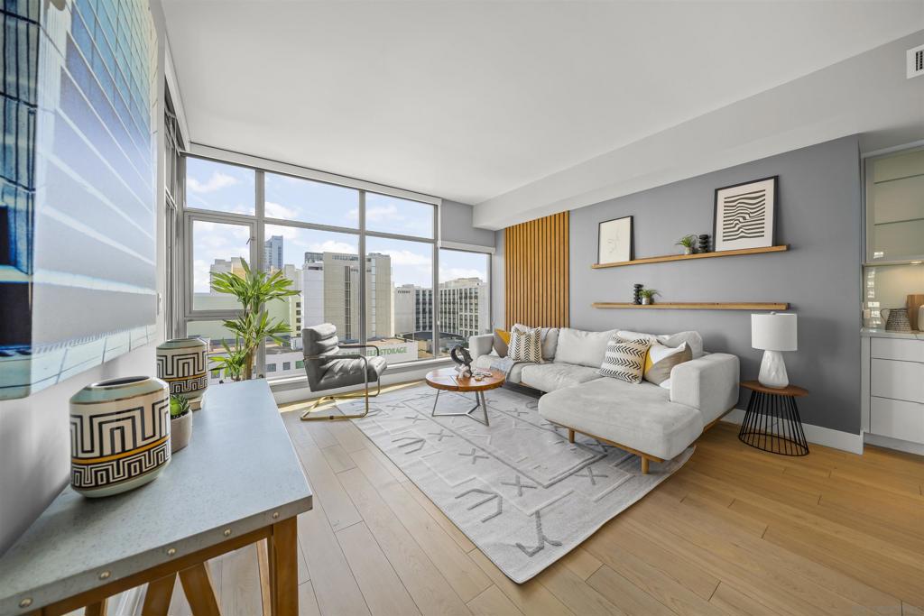 Live at the center of it all in this bright and inviting 2-bedroom, 1.5-bath condo in the desirable Alta building. With an open layout, recently installed hardwood flooring and bathrooms tiles, and oversized windows with rolling shades, this home feels airy and modern while offering beautiful views of Petco Park, Downtown San Diego, and even a peek of the ocean. Perfectly located, you’ll be just a short walk to the Gaslamp District with its endless restaurants, shops, and entertainment options. The condo also comes with a designated parking space and an additional storage unit, adding extra convenience to downtown living. Whether you’re a first-time buyer, investor, or looking for a low-maintenance city home, this property delivers comfort, views, and walkability in one of San Diego’s most sought-after communities.