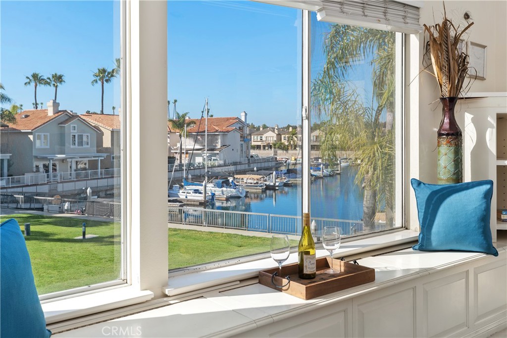 SPINNAKER BAY….one of Long Beach’s finest resort-style communities located in the back bay of the desirable Alamitos Bay area. This corner home features expansive views of the water and lush greenbelt, offering 3 bedrooms, 3 baths plus a valuable 33-foot DEEDED BOAT SLIP!! Inside, you'll find soaring cathedral ceilings and abundant natural light in the spacious living room, complete with a cozy fireplace and an open-concept layout that’s ideal for both entertaining and quiet relaxation. The adjacent dining room flows naturally into the living space, all designed to capture the tranquil outdoor setting. The primary suite is a peaceful retreat, featuring a two-sided fireplace, a private sitting area, and charming water and greenbelt views. Located near California Distinguished Schools, CSULB, and just minutes away from the vibrant 2nd & PCH shopping center, premier boutiques on 2nd Street, excellent dining options, and a variety of water related activities. Truly a must see to appreciate!