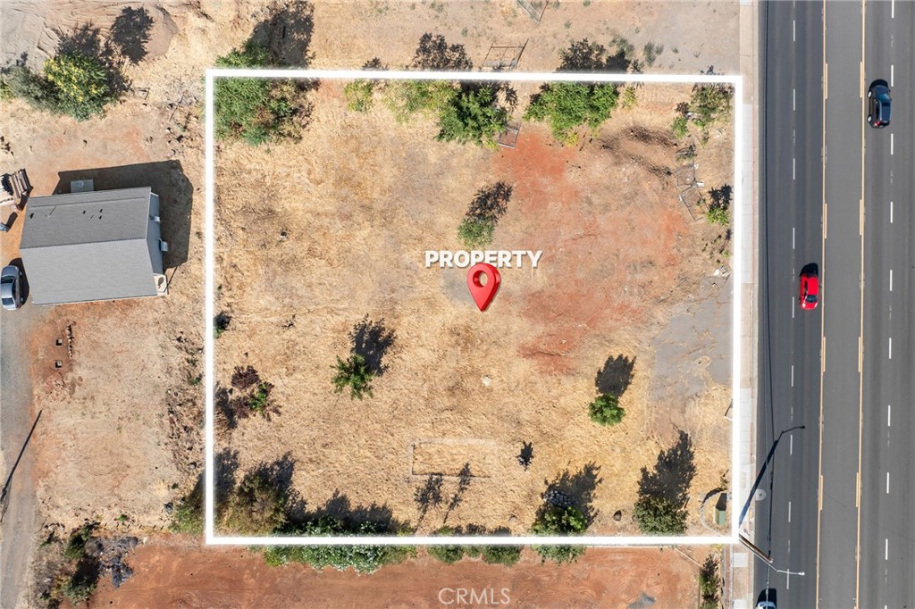 Gateway to Paradise – Prime Commercial Opportunity! Welcome to a property that offers both exceptional visibility and unique flexibility. Located at the gateway of Paradise, this expansive 0.69-acre parcel zoned Community=Commercial l features 152 feet of prime frontage along Skyway, one of the most traveled roads in and out of town. Its strategic location—just south of Paradise Town Hall—places it at the center of activity and growth in this revitalizing community. With completed sidewalks and a convenient turn lane, the property is already set up for easy access and maximum exposure.
What makes this parcel truly stand out is its potential. Beyond its outstanding commercial possibilities, there is also the option—with Town of Paradise approval—to incorporate a residential component, such as a home of up to four bedrooms. This opens the door to a variety of possibilities: a live/work space, a mixed-use design, or a creative investment that combines business with lifestyle. As Paradise continues to grow and rebuild, opportunities in such a high-profile, accessible location are rare. Whether you’re an investor, developer, or business owner, this property provides the perfect canvas to bring your vision to life at the entrance to Paradise.