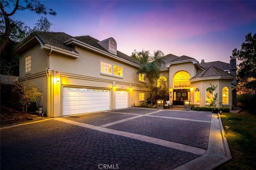Impressive and secluded this Hunt Club VIEW home offers approximately 5,644 square feet of living space with five bedrooms and four and a half bathrooms to include a bright custom downstairs office and spacious great room! With over an acre in property, this home offers privacy and an elegant timeless architectural design that includes an inviting entryway with impressive, coffered ceilings, dramatic staircase and an illuminating crystal chandelier. The long driveway provides ample parking for multiple cars while the backyard offers you an intimate and peaceful setting capturing sunset views! Far reaching view does not disappoint as you enjoy a backyard boasting a tranquil saltwater pool, spa, stone fireplace, and built-in BBQ surrounded by lush tropical landscaping. The backyard also features a covered outdoor living area, perfect for ‘al fresco’ dining and entertaining guests. Inside, the home offers an abundance of natural light, complemented by charming architectural details. Professionally designed and gourmet inspired kitchen has been gorgeously remodeled in sophisticated soft tones, featuring Taj Mahal countertops, custom cabinetry, upgraded Thermador appliances and dual ovens, creating an exceptional cooking and entertaining space. Stone tile back splashes and accents adorn the kitchen with a large island, extensive counter area with wine refrigerator and drawer microwave. From kitchen to family room the flow is seamless and an inviting marble fireplace which creates a large setting for entertaining and family gatherings. Sunken living room- ONLY ONE STEP DOWN- is a cozy retreat off entry and has a marble fireplace centered with coffered ceilings. Downstairs bedroom with an ensuite is perfect for in-laws or guests for added living flexibility! Primary bedroom is spacious with tall ceilings and a deck that captures sunsets and canyon views! The spa-like suite has Carrera white/black marble shower and tub plus newer cabinetry and black matte marble countertops. Three more en-suited bedrooms encompass the upstairs that also anchors a spacious great room and wet bar that has a wraparound side deck to the backyard! The Hunt Club is a guard gated equestrian community that is close to downtown San Juan Capistrano with restaurants/shopping galore. Moments from Dana Pt Harbor and Doheny Bch. Blue Ribbon public schools and well-known private schools of St Margaret's and JSerra are nearby. Embrace a Southern Cal. lifestyle with all that this home offers!