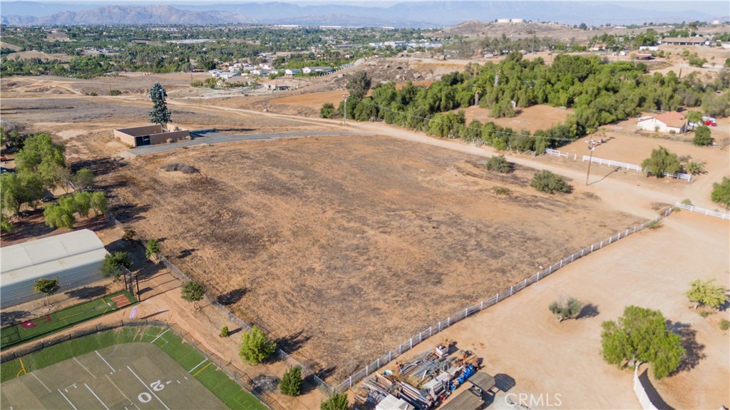 Discover the perfect place to bring your vision to life! This 3.93-acre lot in the city of Perris offers ample, fully usable space, ready to build your dream home. The property features electricity and water available at the front, making development straightforward.
It also includes a telecommunications easement that can provide extra income, making this an even more appealing investment.
Its size and location make it ideal for those seeking a lifestyle with room to roam — perfect for keeping animals, farming, or enjoying your recreational toys such as ATVs, trailers, or boats. Enjoy the peace and privacy of the area while still having convenient access to major roads and essential services.
Don’t miss out on this rare opportunity to own a lot with such potential in Perris.