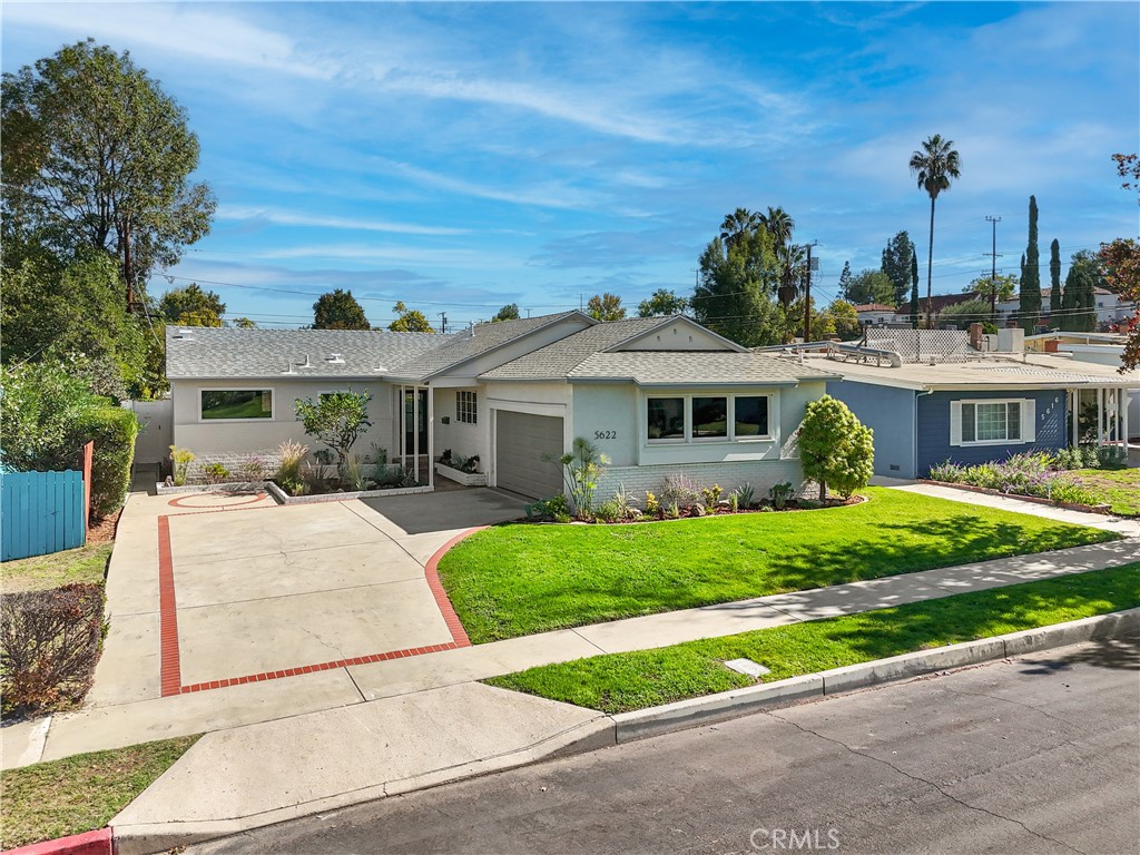 Welcome to this beautiful single-story showplace, nestled in the desirable "Encino Village" neighborhood. This thoughtfully reimagined, light-filled home showcases gorgeous hardwood floors that flow seamlessly throughout. The inviting living rm boasts an open floor plan with high ceilings, recessed lights & a large formal dining room bursting with natural light. The stunning chef's kitchen comes equipped with beautiful custom (soft closing) cabinets, gorgeous quartz countertops, designer tile backsplash, professional-grade stainless-steel appliances & large center island. The primary bedroom w/ walk-in closet offers a sanctuary with a spa-like ensuite bathroom that includes a designer vanity, custom tile/fixtures, and a huge walk-in shower. The secondary bedrooms are good size and are adjacent to the remodeled hallway bathroom, which includes stylish tile, new vanity & relaxing soaking tub. Step outside and enjoy the lush grounds within your private backyard, including... stamped concrete decking, mature foliage & rolling grass that is great for entertaining all your family and friends. With the upgraded HVAC system, new electrical panel, dual paned windows and individual laundry room... this GEM is the one you have been waiting for!