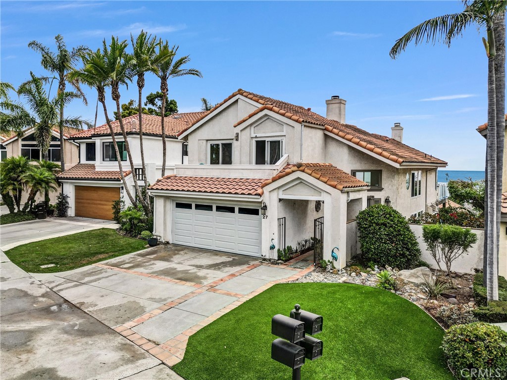 Welcome to luxury coastal living in the prestigious Covenant Community of Regatta!! Stunning Ocean View Tri-Level Home with an elevator in the Exclusive Gated Regatta Community. Located end of single loaded Cul-de-Sac.
This beautifully expanded designed three-bedroom, three-bathroom tri-level home offers the perfect blend of elegance, functionality, and breathtaking ocean views.
The main living area features an open-concept design, perfect for entertaining or relaxing. Kitchen with eating area, diningroom, livingroom with fireplace and a separate family room with another fireplace. Bonus is a full size Sauna and an Elevator connects these 2 floors. This home features expanded Primary Suite wiith large balcony to enjoy the beautiful panoramic ocean views with Catalina sunsets. On same level there are two separate loft areas. The two secondary bedrooms and full bath on it's own level with balcony. The Regatta communtiy pool and spa are located just few steps away. Located across the street from the famous Strands and Salt Creek Beach and just around the corner from Dana Point Harbor. Enjoy the many restaurnats and shops, go paddle boarding or sailing and many more activities.