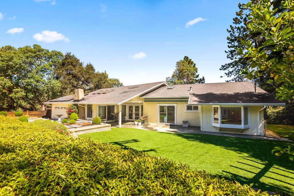 You will love the majestic Valley & Mountain Views from this pristine 2282 sq ft home. Located in a private quiet setting on almost ½ acre in the desired Eastridge Area of Ben Lomond. Sunny living room has, vaulted ceilings, Slumpstone fireplace & a slider to spacious hedged front grounds. Remote controlled skylights in living room, breakfast rm, 3rd bed & kitchen. Sep dining rm has slider on to deck w/piped gas grill. Remodeled kitchen has quartz counters & high end appliances, open to breakfast rm & family rm. Huge 1200 sq ft back deck engineered & built w/ permits has stunning views! Gorgeous Bay windows to views in Master, 2nd bed & breakfast rm. 3rd bedroom has full wall oak built-in desk unit & slider opens to patio. Living, dining, breakfast & kitchen are tile-rest of home is hardwood floors. Eco friendly home w/ owned Solar Energy, 5 zone drip watering system, quality artificial lawns. Security Camera system-remote monitor. 12x16 storage/workshop, outdoor shower & so much more!