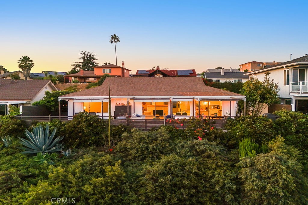 Welcome to the quintessential coastal oasis in the heart of San Clemente, where this rare single-level home offers an unparalleled living experience with breathtaking ocean and sunset views. Nestled on a serene single-loaded street, this residence promises both privacy and tranquility, featuring a gated courtyard adorned with lush landscaping and a charming pergola, perfect for dining al fresco as the coastal breeze whispers through.
Spanning approximately 1,750 square feet, this meticulously remodeled home boasts three spacious bedrooms and two luxurious baths, all thoughtfully designed to enhance comfort and style. The interior exudes elegance with premium finishes, highlighted by ceramic tile flooring that flows seamlessly throughout the space. The kitchen, a true chef's delight, is equipped with state-of-the-art stainless steel appliances and illuminated by contemporary pendant lighting. A large central island becomes the heart of the home, ideal for family gatherings, offering abundant storage and a welcoming ambiance for memorable moments.
The open-concept kitchen and family room are perfectly positioned to capture expansive ocean vistas and mesmerizing sunsets, creating an inviting space for relaxation and entertainment. The two additional bedrooms are generously sized, filled with natural light, providing a bright and airy retreat.
Step into the backyard, a coastal haven designed for entertaining, where you can bask in the beauty of San Clemente's stunning coastline. The outdoor area features an impressive 1,200 square foot Trex deck, complemented by artistic wood beams that support retractable sun shades, blending function and design to create a versatile space. Whether you're hosting a lively gathering or enjoying a quiet evening under the stars, this backyard is a true delight.
Perfectly situated, this home is just moments away from San Clemente's iconic pier, world-class beaches, charming boutiques, and delightful wine bars. Enjoy the proximity to Dana Point Harbor and a variety of shopping options, making it an ideal location for those seeking a vibrant coastal lifestyle.
Experience the epitome of Southern California living in this exceptional property, where every detail has been crafted to offer a harmonious blend of luxury, comfort, and natural beauty. Welcome home to your coastal paradise.