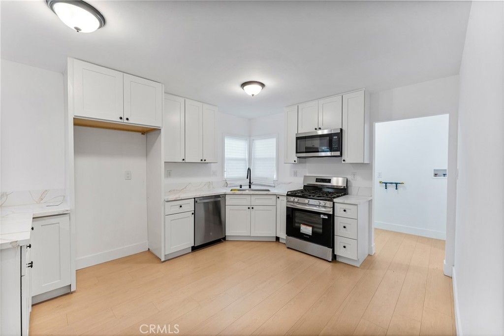 Photo of 4909 Fidler Ave, Lakewood, CA 90712 (MLS # OC25278366)