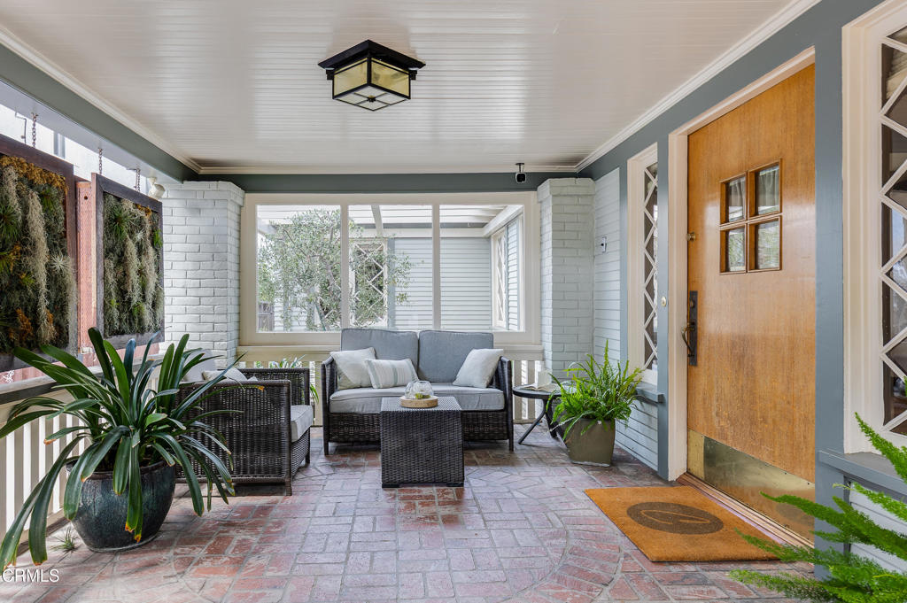 Built in 1919 and lovingly cared for by only three owners, this quintessential California bungalow radiates history, character, and timeless warmth. Nestled in the coveted St. Andrews Square Historic District with preserved period details that blend effortlessly with thoughtful modern updates - you'll enjoy a rare bonus: a converted and expanded garage offering over 642 square feet (taped) of versatile living space.This property not only offers a glimpse into Los Angeles' architectural past but will also provide you a lifestyle enriched by the craftsmanship and design principles of days gone by. Its central location is unmatched - moments from the boutique charm of Larchmont Village, the cultural pulse of DTLA, the elegance of Hancock Park, the trails of Griffith Park and Observatory, and the world-class entertainment of the Hollywood Bowl and Greek Theatre.Inside, handcrafted details of the Arts and Crafts movement have been beautifully preserved. Gleaming oak hardwood floors, original diamond-paned windows, original doors & hardware, and the extensive use of wood trim create a warm, inviting atmosphere. Anchored by the gas fireplace and mantel, the spacious living room overlooks the flawless private front garden and flows seamlessly into a sunlit formal dining room. The chef's kitchen is both stunning and functional, remodeled with today's cook in mind. It features abundant counter space, upscale appliances, a built-in banquette, a mini butler's pantry with sink, and a center island with wine fridge.The home offers three bedrooms, including a serene main suite located on the rear of the home with vaulted beamed ceilings, a custom walk-in closet, and oversized French doors & clerestory window opening to a private deck overlooking the mature back garden.Outdoors, the professionally landscaped front and rear gardens provide multiple exterior spaces - from the cozy covered front porch and private front patio to the shaded dining area and lush rear garden framed by mature hedges and trees.The detached finished bonus space elevates the property even further. With a full kitchenette, a 3/4 bath, an office, and forced heat & air, the area offers remarkable flexibility - perfect as a creative studio, guest retreat or or private workspace. Additional highlights include a separate laundry room w/ abundant storage, parking for 4 cars, forced heat and air, and tankless hot water heater. This is the best of Los Angeles living.