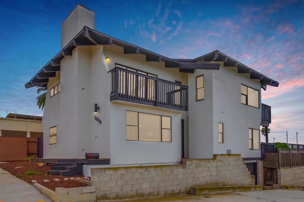 Discover coastal living at its finest in this beautifully updated 4-bedroom, 3-bath home with expansive ocean views from multiple decks. Perched on an oversized corner lot in the heart of Ocean Beach, this 2,238 sq ft residence blends style, comfort, and functionality. Enjoy peace of mind with upgraded electrical, owned solar, and refreshed landscaping that enhances curb appeal. Ideal for entertaining or relaxing, the home features generous outdoor living spaces, including a spacious deck and an outdoor bar—perfectly positioned to catch the ocean breeze. Additional highlights include a 1-car attached garage, a 1-car detached garage, and a large on-site storage building to house all your beach and recreational gear. With no HOA, your lifestyle remains as free and flexible as the ocean air. Just minutes from the beach, vibrant local eateries, unique shops, and top-rated schools, this is your chance to own a piece of San Diego’s iconic coastal charm—complete with sweeping views and unbeatable access to everything Ocean Beach has to offer.