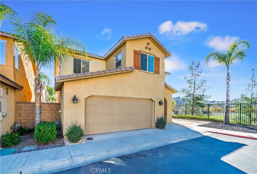 Set in one of the most sought-after spots in Canyon Hills, this home gives you the kind of view people move to this community for. From the moment you step inside, the hills stretch out in front of you, and the living spaces are designed to make the most of every bit of it. This is the largest floor plan in the neighborhood, offering the extra room and comfort buyers are constantly hoping to find but rarely do. The layout is ideal for everyday living and for hosting. There’s a full bedroom and bathroom downstairs, perfect for guests, extended family, or anyone who wants a little more privacy. The main living area is open, bright, and positioned toward the panoramic backdrop that sets this property apart. Step outside to a covered patio and a spacious corner-lot yard that’s ready for quiet mornings, weekend gatherings, or simply enjoying the sunset settling over the hills. Upstairs, the primary suite feels like a retreat all its own. Wake up to the rolling landscape right outside your window, unwind in a generously sized bath, and enjoy the convenience of a true walk-in closet. The additional bedrooms are well-sized, giving everyone their own comfortable space. With its rare location, expansive floor plan, and views that follow you from room to room, this home delivers the lifestyle buyers dream about when they picture Canyon Hills. Homes in this setting don’t come up often—especially not ones that check this many boxes.