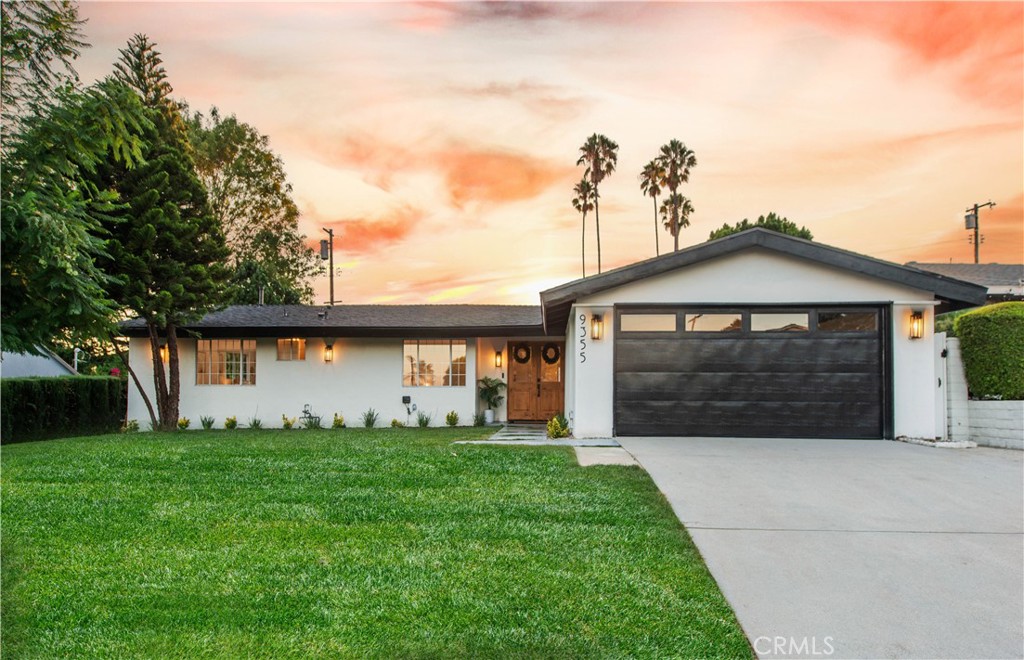 Step into timeless elegance with this beautifully reimagined Mid-Century home in sought-after Walnut Cove. Blending classic design with modern luxury, this 4-bedroom, 3-bathroom masterpiece offers an open, flowing floor plan filled with warmth, sophistication, and thoughtful upgrades throughout. From the moment you arrive, the home’s exceptional curb appeal makes a lasting impression—lush green lawn, striking double wood-and-glass entry doors, and a welcoming presence that sets the tone for what lies within. Inside, every detail has been meticulously curated, from arched doorways to custom finishes, creating a space that feels both stylish and inviting. Soaring ceilings enhance the open-concept layout, seamlessly connecting the expansive living room—anchored by a cozy fireplace—to the airy dining area and chef’s kitchen. The kitchen is a showstopper, featuring a stunning scalloped tile backsplash, sleek white and wood cabinetry, an oversized bar with built-in beverage fridge, and premium appliances including a 6-burner Cosmo range and counter-depth refrigerator. Whether you're hosting a dinner party or enjoying a quiet evening, this space is designed for entertaining. Retreat to the luxurious primary suite with vaulted ceilings, direct access to the pool, and a spa-inspired bathroom with an oversized shower and double vanity. The guest bedroom is bathed in afternoon light and overlooks the private backyard oasis. Two additional bedrooms are connected by a beautifully updated Jack & Jill bathroom, offering the perfect blend of style and function. Step outside to your own private escape—an entertainer’s dream with a sparkling pool, covered patio, and elevated lounge area ideal for summer nights and weekend gatherings. This home has been remodeled with both style and practicality in mind. You'll love the large laundry closet (designed for side-by-side or stacked machines), ample linen storage, direct garage access, and an abundance of cabinetry and pantry space. All the work has been done from top to bottom—just pack your bags and move in. Welcome to your dream home in Walnut Cove.