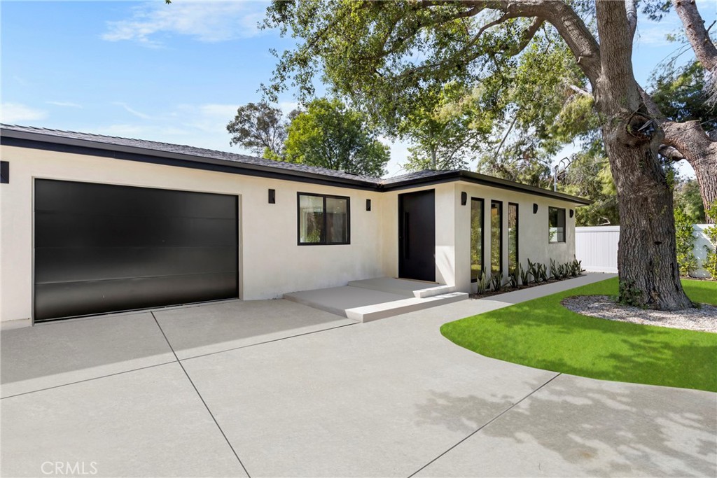 Stunning reimagined home in the heart of Tarzana! This move-in-ready property features modern finishes throughout, including a chef’s kitchen with a large island, quartz countertops, and brand-new stainless steel appliances. Enjoy a massive front yard with lush grass and ample parking. Located just minutes from top-rated restaurants, shopping, and easy freeway access—this home offers the perfect blend of luxury and convenience.
