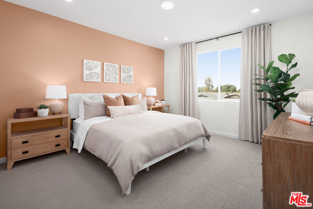 No Mello-Roos! This move-in-ready 3-bedroom, 2.5-bath townhome at The Grove at Merced offers a thoughtful balance of comfort, design, and functionality - ideal for modern living in the heart of West Covina. From the moment you arrive, the home makes a strong impression with its fully landscaped and hardscaped front patio, enhanced by an upgraded landscape package that adds beauty and low-maintenance convenience. Step inside to a bright, open-concept main level where LVP flooring flows throughout, offering a clean, cohesive look that's easy to maintain. The spacious great room connects seamlessly to the dining area and a modern kitchen, which features crisp white shaker-style cabinetry, quartz countertops, and stainless steel finishes. Ample counter space and storage make the kitchen efficient and inviting - whether you're preparing daily meals or hosting friends. A conveniently located powder bath completes the main floor. Upstairs, three spacious bedrooms and a well-thought-out layout create a sense of privacy and flexibility. The primary suite includes a walk-in closet and a well-finished en-suite bathroom with dual sinks and a walk-in shower. Two secondary bedrooms share a full bath and are perfectly suited for family, guests, or a home office. A generously sized upstairs laundry room helps streamline daily routines. Additional features include a 2-car garage with EV-ready pre-plumbing, dual-pane energy-efficient windows, Wi-Fi-ready wiring, a programmable thermostat, and a smart video doorbell. Solar panels are available for lease or purchase, offering long-term energy savings. Located within a thoughtfully designed community with picnic areas, BBQ space, a dog station, and landscaped open spaces, this home delivers a low-maintenance lifestyle with modern comfort and practical upgrades - perfect for buyers seeking a fresh start with lasting value. Virtual tour is of model home and used for representational purposes only.