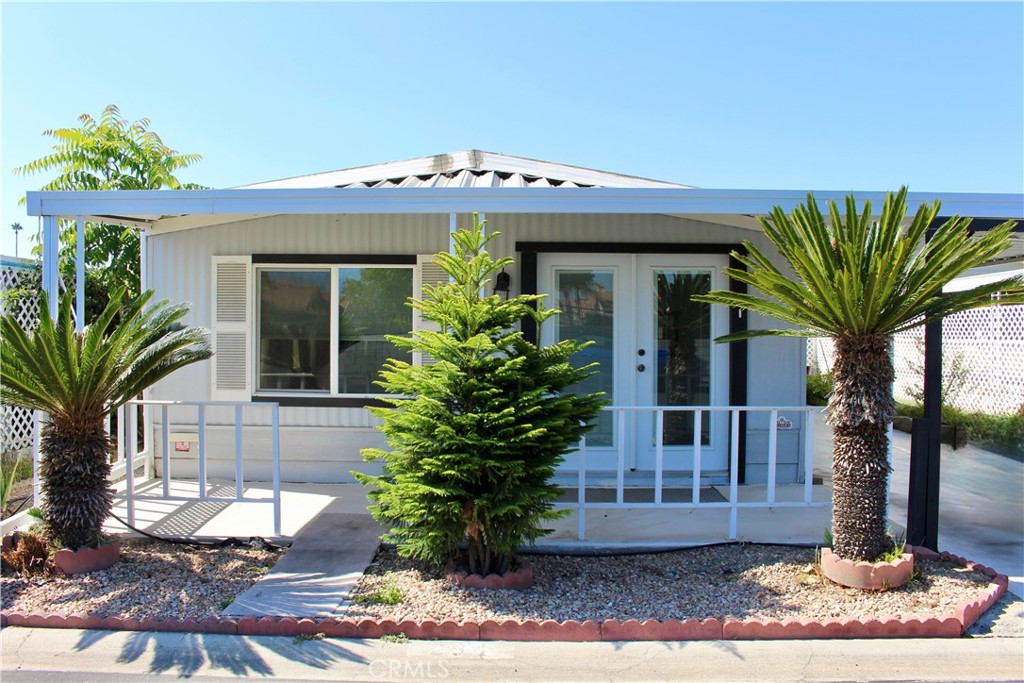 Manufactured Home
Roof: Metal
Built in 1980
What's special
NEW FURNACE STYLISH STAINLESS STEEL APPLIANCES
Discover a charming ground-level manufactured home in the desirable Colonial Country Club, a premier 55+ community in the City of Hemet. This beautifully renovated 2-bedroom, 2-bathroom residence offers 1,000 sq ft of move-in-ready comfort. The home boasts a range of modern upgrades, including new doors, new french door at main entrance, new flooring throughout, a brand-new HVAC system, a brand-new water heater, and energy-efficient double-pane windows. Designed for both relaxation and convenience, the living space seamlessly integrates a cozy living room, a formal dining area with a built-in hutch, a welcoming family room that flows into the well-equipped kitchen and a new irrigation system. Residents of Colonial Country Club enjoy an unparalleled array of community amenities. Visit the Large Library where you can find magazines, puzzle games, books. Enjoy playing pool table. Tee off on the free golf course, practice your short game on the putting green, or stay fit at the well-appointed fitness center. Pamper yourself at the on-site hair salon, challenge friends to a game in the billiards room or on the shuffleboard courts, and socialize in the elegant ballroom. Aquatic exercise class Monday , Wednesday and Friday mornings. The heated pool and spa offer year-round relaxation, and pickleball courts promise even more recreational options. There are games, fun activities schedule through ea. month. pet grooming, Dog park, Laundromat on the side. Conveniently located within 5 minutes.