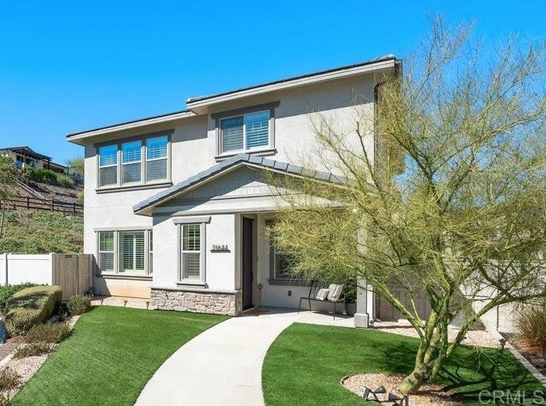 Peacefully situated in the rolling hills of Escondido, this Harmony Grove Village 2018 built home delivers that “away from it all” feel while still keeping you minutes from everything North County has to offer. With 4 bedrooms, 3 baths, and nearly 2,900 sq ft, it blends modern design with everyday comfort. The upgraded chef’s kitchen with a generous island and walk-in pantry flows into the open living and dining spaces. Just beyond, the California Room with fireplace creates a dreamy indoor/outdoor extension leading to your private, fully fenced turf yard. With no neighbors behind and the home set back from the street, you’ll enjoy an extra layer of privacy—perfect for BBQs, gatherings, or simply unwinding in peace. Downstairs features a guest bedroom and full bath, while upstairs offers a spa-like primary suite with a massive walk-in closet, a generous loft (with potential for an additional bedroom), an oversized laundry room, and plenty of storage to keep life organized. The real star of the show? Owned solar! Plus, a tankless water heater and smart thermostats keep energy bills in check. Life in Harmony Grove Village means resort-style amenities at your fingertips with pools, trails, mountain views, parks, and a sense of community, all right outside your door. And when it’s time to venture out, you’re just a short drive to Del Sur, San Elijo, the Carlsbad beaches, local dining, breweries, and Downtown Escondido shopping.