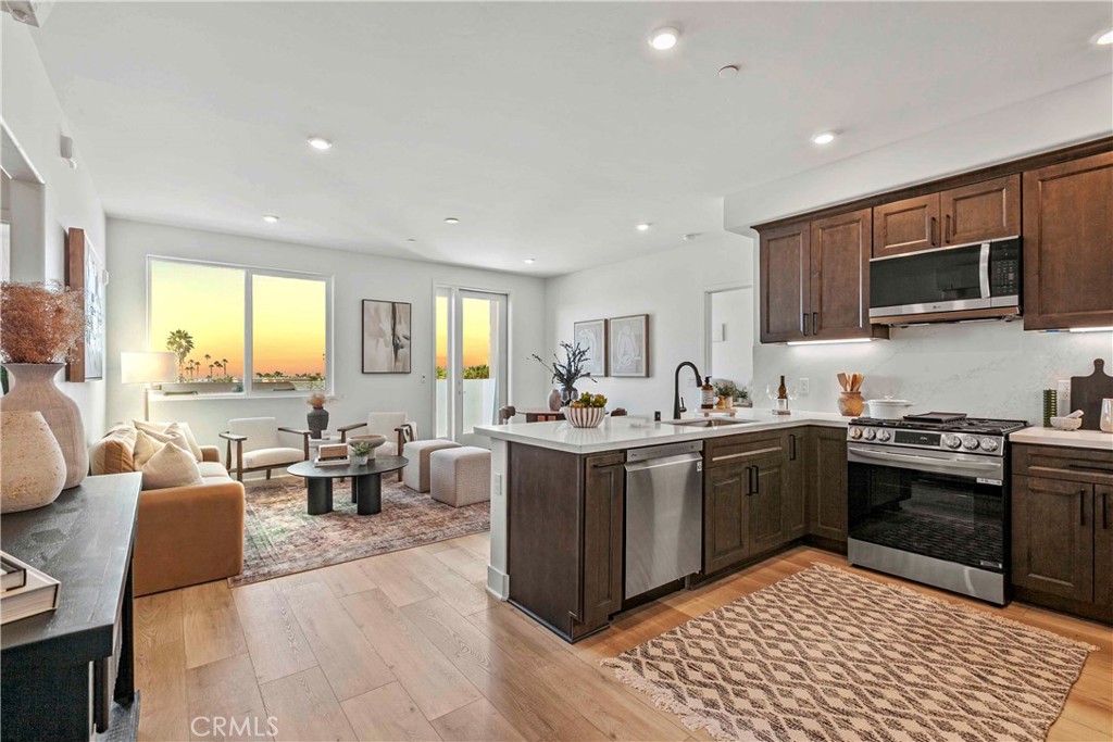 Enjoy the best of coastal living in this brand-new Grover Beach condo. This thoughtfully designed 2-bedroom, 2-bath luxury condo located at the new West End of Grover Beach provides convenience mixed with modern style. This unit is also located within walking distance to the beach and fantastic local restaurants. Upon walking in, you will be greeted with a stunning ocean view directly in front of you as well as from both bedrooms. This former builder's model unit has never been lived in. Appliances are brand new including washer/dryer, refrigerator, etc. Residence includes under-cabinet lighting, 3 energy-efficient split units for heating and cooling, ceiling fan hookups, and TV-ready outlets throughout. Building amenities include a beautiful rooftop deck with seating areas and BBQ, lobby area and an elevator. Also provides assigned parking space. Sewer and trash included in HOA. Also comes with large storage closet just outside the unit in hallway. Reach out today to schedule a private showing for this premier condo at Palladium!