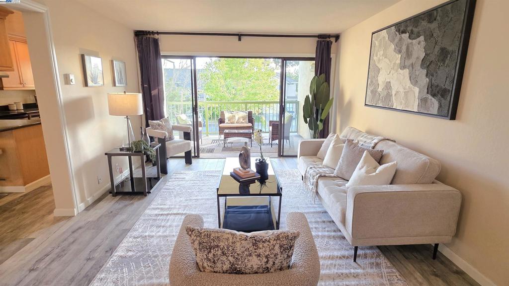 This bright and inviting 1 bedroom, 1 bath condo is located on the second floor and offers a perfect blend of comfort and convenience. Step inside to find sleek laminate flooring throughout, complemented by modern wood cabinets and stainless steel appliances in the kitchen. Enjoy the ease of in-unit laundry and the peace of mind that comes with well maintained amenities. Residents have access to a community gym and refreshing pool - perfect for staying active and relaxed year round. Elevator available and underground secure parking garage. Ideally situated just a 15 minute walk to BART and close to downtown shops, dining, and entertainment. Zoned for the highly rated Parkmont Elementary. This home is an ideal choice for first time buyers, commuters, or investors.