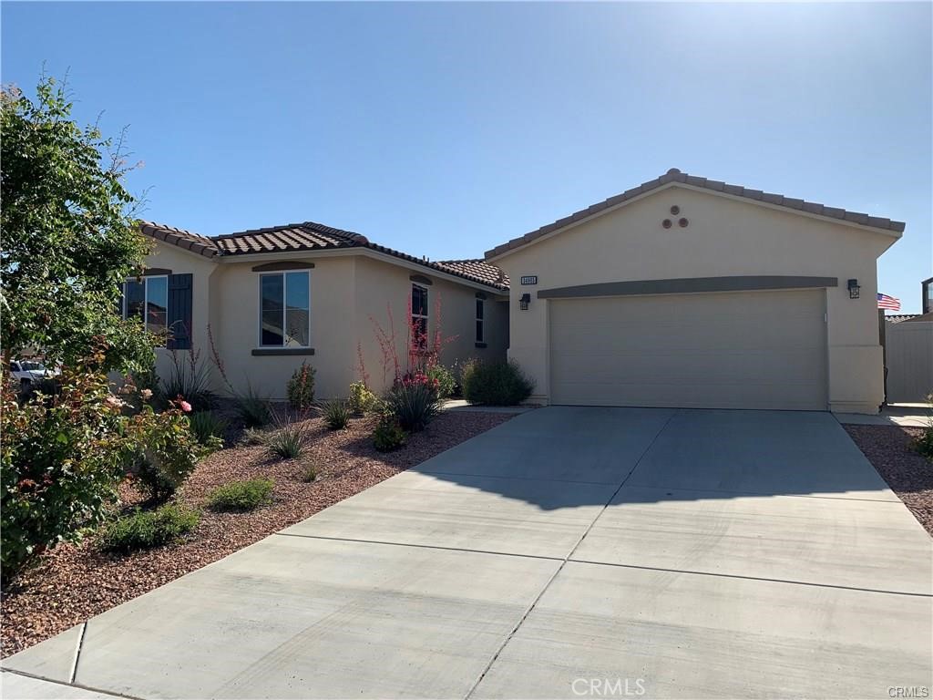 Presenting an exceptional single-story turnkey residence. Tucked away in the quiet, established neighborhood of Sweetwater/Heritage Ranch, it offers easy access to top-rated schools, shopping, and freeways, as well as a newly developed playground and sports park. This home offers the perfect blend of comfort, style, and privacy. Positioned on a corner lot near a cul-de-sac, this home showcases four bedrooms, two bathrooms, and an expansive open-air floor plan featuring tile and laminate flooring throughout. The thoughtfully appointed gourmet kitchen includes a spacious island, granite countertops, and upgraded cabinetry. The living and dining areas, along with a covered patio, provide a generous space for entertainment or just lazing around. The primary suite offers both size and elegance. NEW paint entire interior. Drought-tolerant plants and fruit trees beautifully landscape the front and rear yards. All windows are fitted with reflective film to enhance privacy and reduce heat. One owned solar system and a secondary financed system, equipped with a three-element Tesla battery pack (buyer to assume at $157/month), supply ample energy for the household, including an EV circuit, and ensure SCE pays you. The battery pack provides 8+ hours of backup power for the entire home.
Experience a remarkable blend of sophistication and sustainability in this exceptional home. Make this outstanding home your family’s new sanctuary.