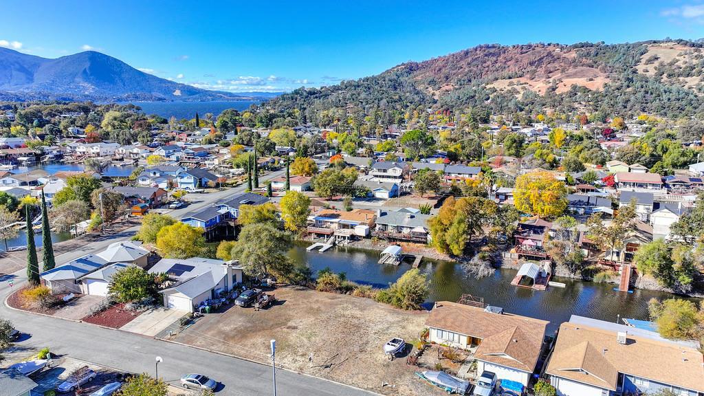 This level, buildable double lot in the sought-after Clearlake Oaks Keys offers ample space for your dream home(s). Located on a paved road in a friendly neighborhood, the property is just steps away from canal access at the rear. With both water and sewer connections already in place, its ready for construction. Water service requires only a $50 transfer fee and a $119 monthly base rate. The HOA fee is just $85 annually, and membership to the community pool center is optional. Conveniently located between San Francisco (2.5 hours away) and Sacramento (2 hours away), this lot is also close to local attractions like Brassfield Winery. Enjoy all that Lake County has to offer with this generous double lotperfect for your next project.