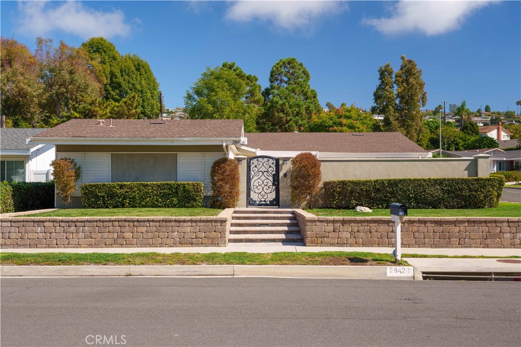 Refined Coastal Luxury in Rancho Palos Verdes. Experience elevated single-level living in this exquisitely updated residence, ideally situated on a serene corner lot in one of Rancho Palos Verdes’ most desirable neighborhoods. Spanning approximately 2,157 sq. ft., this four-bedroom, three-bath home has been beautifully refreshed with new designer paint and luxury vinyl plank flooring throughout, creating a seamless blend of modern sophistication and timeless comfort. A private courtyard entry welcomes you into the expansive open floor plan, where vaulted ceilings, sun-drenched living spaces, and elegant finishes set the tone for refined living. The gourmet kitchen showcases rich custom cabinetry, granite countertops, and premium stainless-steel appliances—perfect for both everyday living and stylish entertaining. The primary suite is a tranquil retreat, thoughtfully positioned apart from the secondary bedrooms for ultimate privacy. It features a luxurious spa-inspired bath with double vanities, a walk-in closet, and an oversized rainfall shower. A second en-suite bedroom provides ideal accommodations for guests or extended family, while two additional bedrooms complete the flexible floor plan. French doors open to an enchanting backyard oasis with lush landscaping and mature trees, offering the perfect backdrop for alfresco dining or quiet relaxation. Set on an expansive 9,000+ sq. ft. flat lot, this home embodies the essence of indoor-outdoor California living. Located within walking distance to award-winning schools and moments from scenic trails, beaches, and world-class golf, this stunning property combines coastal tranquility with luxury living at its finest.