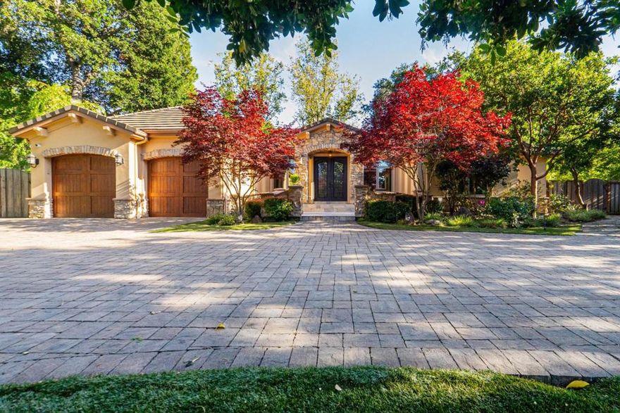 Welcome to 15090 Park Dr,  a luxuriously appointed residence sets on nearly half an acre of flat land in the heart of the majestic Montalvo area. This elegant home was fully remodeled in 2015. Step inside to find a grand foyer with luxury marble flooring, leading to a formal living room with a quartzite-surround gas fireplace and a dining area with direct patio access. The office, adorned with custom bookshelves and cabinets, offers a charming and distinguished workspace. The gourmet kitchen boasts high-end cherry cabinets, a large island, and a suite of professional-grade appliances from Wolf® and Subzero®. The family room shines with abundant natural light. Primary suite offers a private balcony and a spa-like bathroom with a marble Jacuzzi. Junior suite offers a peaceful retreat.  Additional bedrooms feature custom blinds and updated bathrooms. Outdoors, enjoy a landscaped yard, basketball court, and a cabana with a sauna. This home combines sophisticated design with unparalleled comfort, making it an exceptional place to live. Minutes from downtown, enjoy local markets, Safeway, and quaint cafes. Nearby top-rated Saratoga schools are ideal for families. With quick access to highways 85 and 17, commuting to major tech companies like Apple, Netflix, and Nvidia is effortless.