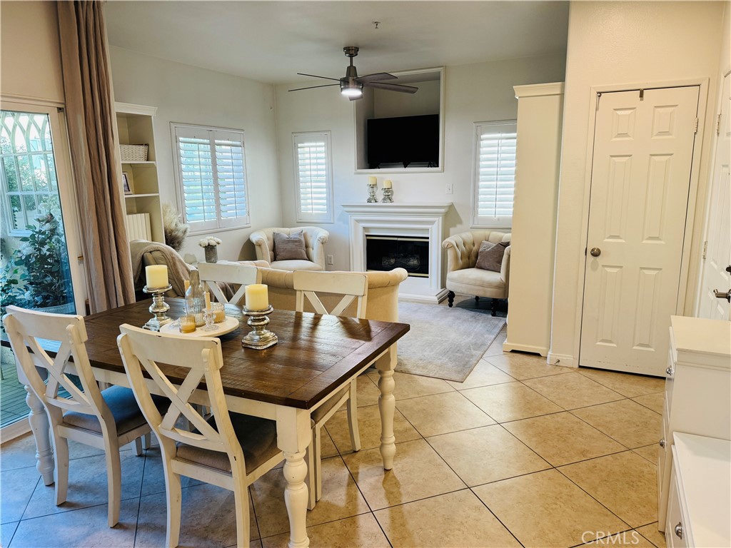 Welcome to this beautifully updated ground-level two-bedroom, two-bathroom home located in the desirable gated community of Verona. This charming residence offers a private courtyard entrance and is conveniently located near Harveston Lake, the Promenade Mall, Old Town Temecula, Murrieta Hot Springs Resort and the area’s renowned wineries. As you enter, you’ll immediately notice the pride of ownership throughout. The open layout features tile flooring in every room, which creates a great cohesive look and keeps the home cool during warmer months. Comfort is further enhanced by a brand-new air conditioning unit. The spacious living room includes a gas fireplace complete with a custom mantel and a built-in alcove above, ideal for a TV or decorative artwork. The adjacent kitchen has been refreshed with painted cabinetry, updated hardware, a stainless-steel sink, new stainless-steel appliances, and a six-stage APEC reverse osmosis water filtration system. The primary bedroom features a tray ceiling, an en-suite bathroom, and a walk-in closet. The secondary bedroom is generously sized and can be used as a guest room, child’s room, or a home office. Both the primary and guest bathrooms’ tub and shower areas have been recently reglazed, and the guest bathroom is complete with a pedestal sink.
Additional features of this home include ceiling fans in all major rooms, LED recessed lighting throughout, plantation shutters, brushed nickel door hardware and Moen hardware throughout, a fire sprinkler system, a deep entry closet perfect for storage and an LG Wash tower that will stay with the home. All stainless-steel appliances are included making this move-in ready. Through the sliding glass door off the dining area, you’ll find a spacious private patio perfect for relaxing or outdoor dining. The home includes a one-car detached garage with a brand-new Lift Master garage battery and spring and is located very close to the unit, along with ample open parking available throughout the community. Verona offers a well-maintained environment with resort-style amenities, including a heated swimming pool, spa, and fitness center. The HOA maintains the landscaping throughout the gated community and provides roving security for added peace of mind. This move-in-ready home combines modern updates with a fantastic location—don’t miss this opportunity!