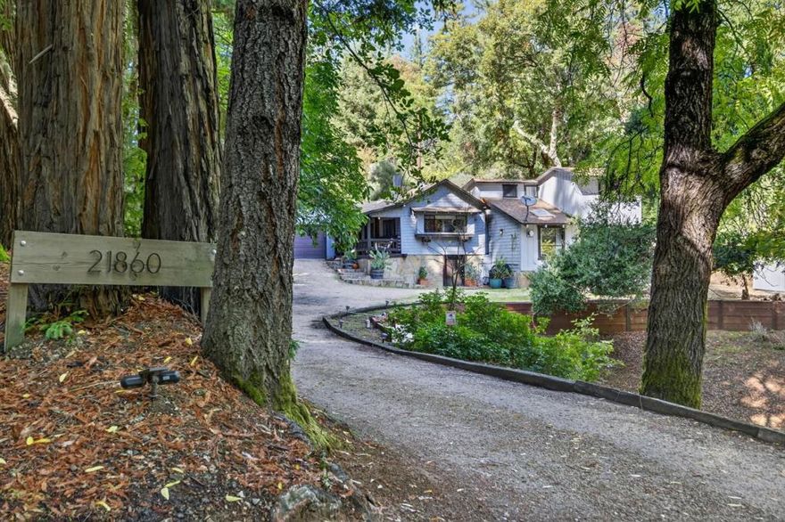 So much newness! Expanded from original cabin around 2008. Since 2021: New oak floors, new whole house generator, new steel ducting, much more. Charming 4 bd. 3.5 ba. home is modernized and part of Los Gatos history. Primary plus one more en-suite bdrm!  Natural light fills the living areas including the kitchen where a large center island, gas stove, and lots of counter space make cooking a joy! The primary suite opens to the back deck with beautiful views and features a walk in closet and oversized tub for the ultimate relaxation. One additional en-suite room, plus 2 more bedrooms! An inviting living room with cozy Jotul gas stove opens to the back deck where the jacuzzi awaits. What is a mtn. home without a wood-beam ceiling wine cellar? Keep your collection cool in this fun space! Steps away, a separate stand alone office space, updated in 2024 and now complete with AC/Heat, recessed lighting, and more, perfect for work-from-home, she-or-he-shed or other!  Frontier fiber ready, Starlink available. 3.5 ac. lot, some usable land! Fruit trees produce in abundance, chicken coop is ready for your chickens, sun and shade, this is a truly beautiful setting!  It's quick and easy to get onto Bear Creek Road and then you are just 8.7 miles into downtown Los Gatos.  Los Gatos schools!