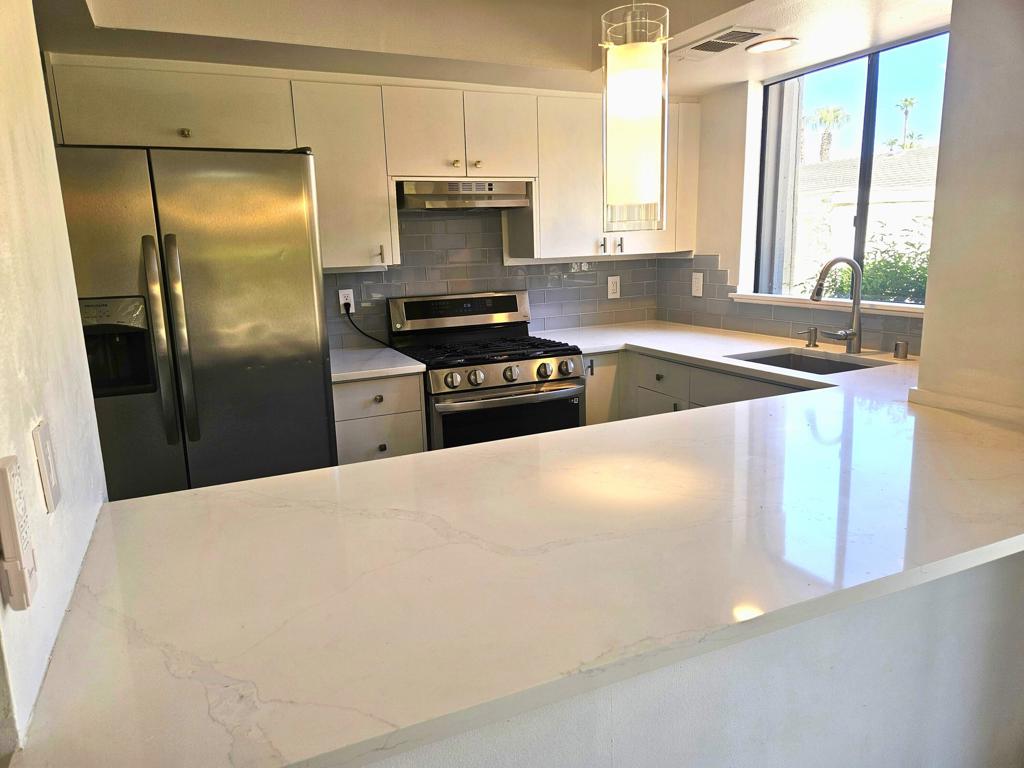 Opportunity meets flexibility in the heart of Indian Wells! Whether you're ready to buy now, lease with the option to own, or simply enjoy a long-term lease, this updated 2 bed, 2 bath condo in the scenic gated community of Mountain Cove has you covered. Step inside to find all-new flooring throughout, a modernized kitchen with fresh counters, floors, and sink, and remodeled bathrooms that offer both style and comfort. Cozy up by the fireplace, take in stunning mountain views from one of three private patios, and enjoy convenient main-level living with a shared two-car garage. The community features a resort-style pool and spa, and you're just minutes from top-tier shopping and dining. Located in the Imperial Irrigation District for lower electric costs and on a land lease through 2069, this is a rare blend of lifestyle, location, and long-term value. Don't miss your chance to make this your next move.