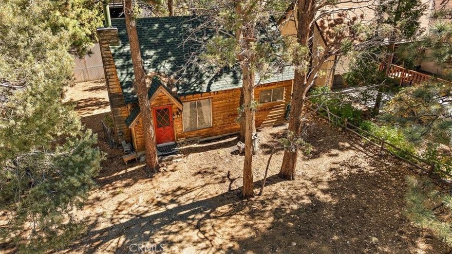 Adorable Mountain cabin large 1 bed, 1 bath, plus loft cabin situated in Sugarloaf, just minutes from Big Bear Lake and Bear Mountain Resorts. Whether you're into hiking, biking, bird watching, or winter sports, this cozy cabin puts you right in the heart of it all. Enjoy the large rock fireplace living room, complemented by natural gas heating for comfort year-round. The property features a treed 5000 SQFT lot and a fenced back yard—for pets and kids, for outdoor entertaining or simply soaking in the serene surroundings. Whether you're seeking an affordable second home, a short-term rental opportunity, or a charming mountain cabin, this is it!