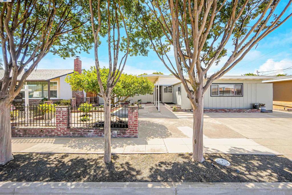 Immaculately Kept Winton Grove Charmer Just Hit the Market! Step inside to discover brand-new flooring throughout and fresh interior paint that gives this home a bright, modern feel. Updates include stylish new lighting, fixtures, and tasteful finish upgrades. Flooded with natural sunlight, the space feels warm and inviting. The charming, low-maintenance front yard offers ample parking, mature fruit trees, and neat, drought-tolerant landscaping. The garage has been thoughtfully converted into a spacious family room with a dedicated laundry area—ideal for flexible living. Enjoy a backyard oasis with lush peach, plum, and persimmon trees, plus a handy bonus shed perfect for storage, a workshop, or hobby space. Conveniently located near major freeways, shopping, and more—this home offers comfort, charm, and incredible value!