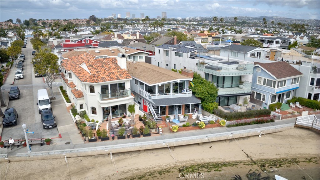 RARE OPPORTUNITY ON THE SOUTH BAYFRONT OF BALBOA ISLAND! Imagine, twice the home on the fabulous Newport Beach Harbor! Walk out your front door and experience the sun, the fresh air, the calmness and the beauty of the bay! Side by side South Bayfront, Balboa Island lots available on a CORNER! Wonderful location near the west end of South Bayfront. Never ending views of the harbor! Build your dream home! This is an opportunity of a lifetime! Existing structures will provide 3 incomes while you walk through the process of combining these two wonderfully located properties. Create your waterfront legacy!
This listing is for both 300 South Bayfront and 302 South Bayfront combined! 300 South Bayfront is a single family home with 2 family rooms, one up and one down, 3 bedrooms, 5 baths and 2 car garage. The lot size is 2,640 sq ft. The sq ft of the existing structure is 2,429 sq ft and it was built in 1991. The property at 302 South Bayfront, the lower unit, is a 3 bedroom 2 bath and 1 carport with an electric car charger. The lot size is 2,553 sq ft. The existing structure, a duplex, was built in 1968. The upper unit has 4 bedrooms, 3 baths and 1 carport. Together the lots combined come to 5,193 sq ft and would create approximately 60 feet of south bay frontage.
The undergrounding of the utilities is almost complete! No utility poles or wires in your rooftop deck view! From the sea to the mountains! Both properties have electric car charging stations installed. The duplex only on the lower unit. This fact is less important if you plan to tear down and build a single family with the required ADUs. The income on this property will go a long way in helping you get through the City of Newport Beach, the Coastal Commission and designing phase of your new home.
At this point in time, the Sellers are not interested in selling the houses separately. This is a listing for two properties being sold together. (buyer to verify the information in this listing) All measurements are approximate and suggestions to build are to be verified by the City of Newport Beach, Coastal Commission and Architect as to the potential of what is allowed.