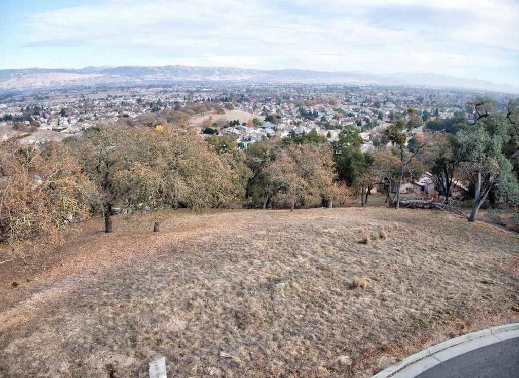 Gorgeous court lot located in Country Estates for sale! Get your plans together and build your custom dream home. Offering a generous pad on one of the larger lots, this 1.45 acre property offers beautiful panoramic views of the valley, city lights and the East mountains. The lot is surrounded by elegant high value homes in an established community. Only minutes away from downtown Gilroy & Morgan Hill, easy commuter access to train station and 101 Highway, golf links, shopping and top-rated schools. Professional photos soon. Don't miss this opportunity!