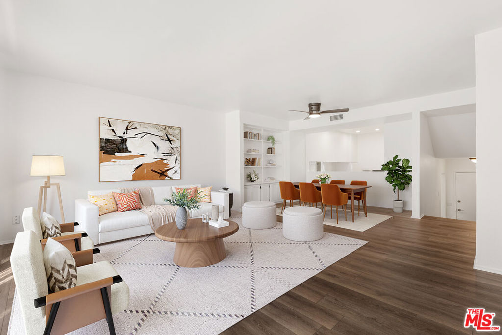 Located in a desirable Panorama City community, this freshly remodeled three-bedroom, three-bath townhouse-style home combines spacious living, modern finishes, and resort-style amenities in one turnkey package. With approximately 1,402 square feet of interior space, the home welcomes you with wide-plank wood-style floors, crisp white walls, and recessed lighting that creates an airy, gallery-like feel. The open-concept living area features a sleek fireplace, large windows with soft natural light, and seamless flow to the dining space, creating an inviting atmosphere for everyday living or entertaining. The updated kitchen boasts white shaker cabinetry, quartz-style countertops, stainless steel appliances including a gas range with statement hood, and a floating wood shelf for warmth and display. Upstairs, three well-proportioned bedrooms offer plush carpeting, generous closet space, and abundant light. The primary suite includes an en-suite bath, ample storage, and enough room for a king bed plus a seating area or desk, while the secondary bedrooms are perfect for guests, family, or a home office. Each bathroom has been thoughtfully upgraded with modern vanities, sleek fixtures, and neutral palettes that evoke a spa-like feel. Practical features include a powder bath on the main level, multiple storage closets, and convenient in-unit laundry connections. A rare direct-access private two-car garage adds security and ease, making this residence feel like a true single-family home. The well-maintained complex offers a sparkling pool and spa with sunny lounge areas, mature landscaping, and well-run HOA services that provide an attractive, low-maintenance environment year-round. Residents appreciate the community's proximity to the revitalizing Van Nuys Corridor, local parks, and a variety of shopping and dining options, as well as easy access to major freeways for streamlined commutes. Nearby Sherman Oaks, North Hollywood, and the Valley's emerging hot spots provide endless choices for nightlife, fitness, and entertainment, while the neighborhood retains a peaceful residential feel with tree-lined streets and a welcoming atmosphere. Combining style, comfort, and convenience, 14500 Van Nuys Blvd #33 is a move-in-ready home offering the best of townhome living in a prime Panorama City location with every amenity close at hand. Photos have been virtually staged.
