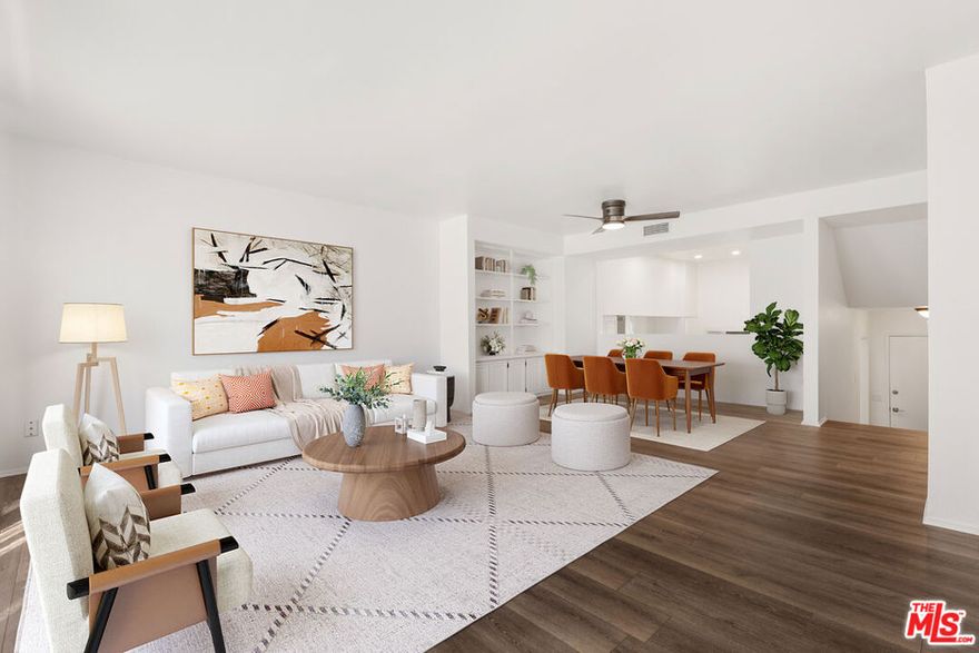 Located in a desirable Panorama City community, this freshly remodeled three-bedroom, three-bath townhouse-style home combines spacious living, modern finishes, and resort-style amenities in one turnkey package. With approximately 1,402 square feet of interior space, the home welcomes you with wide-plank wood-style floors, crisp white walls, and recessed lighting that creates an airy, gallery-like feel. The open-concept living area features a sleek fireplace, large windows with soft natural light, and seamless flow to the dining space, creating an inviting atmosphere for everyday living or entertaining. The updated kitchen boasts white shaker cabinetry, quartz-style countertops, stainless steel appliances including a gas range with statement hood, and a floating wood shelf for warmth and display. Upstairs, three well-proportioned bedrooms offer plush carpeting, generous closet space, and abundant light. The primary suite includes an en-suite bath, ample storage, and enough room for a king bed plus a seating area or desk, while the secondary bedrooms are perfect for guests, family, or a home office. Each bathroom has been thoughtfully upgraded with modern vanities, sleek fixtures, and neutral palettes that evoke a spa-like feel. Practical features include a powder bath on the main level, multiple storage closets, and convenient in-unit laundry connections. A rare direct-access private two-car garage adds security and ease, making this residence feel like a true single-family home. The well-maintained complex offers a sparkling pool and spa with sunny lounge areas, mature landscaping, and well-run HOA services that provide an attractive, low-maintenance environment year-round. Residents appreciate the community's proximity to the revitalizing Van Nuys Corridor, local parks, and a variety of shopping and dining options, as well as easy access to major freeways for streamlined commutes. Nearby Sherman Oaks, North Hollywood, and the Valley's emerging hot spots provide endless choices for nightlife, fitness, and entertainment, while the neighborhood retains a peaceful residential feel with tree-lined streets and a welcoming atmosphere. Combining style, comfort, and convenience, 14500 Van Nuys Blvd #33 is a move-in-ready home offering the best of townhome living in a prime Panorama City location with every amenity close at hand. Photos have been virtually staged.