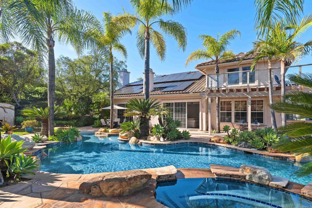 Welcome to Rancho Verde Estates, one of Escondido’s most coveted luxury communities, where breathtaking panoramic mountain views, resort-style amenities, and modern upgrades converge on a private 0.92-acre estate—and with NO HOA! This 5-bedroom, 4-bathroom estate offers the ultimate in Southern California indoor-outdoor living, complete with a PebbleTec vanishing-edge pool, spa, cascading waterfalls, beach entry, outdoor shower, and a sprawling flagstone patio perfect for entertaining under the stars. Property Highlights: First-floor primary suite with fireplace + direct access to backyard. Gourmet chef’s kitchen with stainless steel appliances, center island, and walk-in pantry. Soaring ceilings and open-concept layout for natural light and flow, Upstairs guest suite with private bath and view deck — ideal for multi-generational living or home office Recent Upgrades: Luxury LVP flooring throughout main living areas, Brand-new carpet upstairs, Dual solar systems: 30 owned panels + 17 leased panels, Tesla Powerwall + EV charger, Whole-house water filtration and softener system Outdoor Amenities: Sand volleyball court (or future pickleball court!) Fenced dog run, Chicken coop, Outdoor security camera system, Plenty of space to add an ADU, casita, or RV parking. Located just minutes from Lake Hodges, top hiking & biking trails, shopping centers, and scenic routes to the coast—this home blends privacy, luxury, and location in one incredible package.