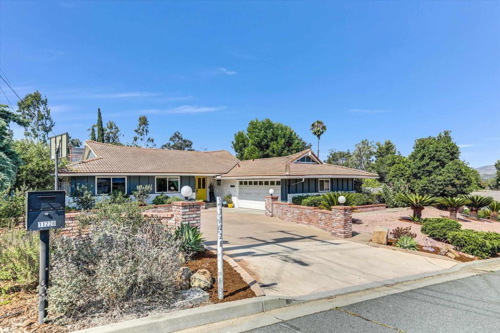 Single-Level Serenity in Sought-After Horizon Hills! Nestled on a lush half-acre, this upgraded 3BR/2BA + bonus room w/full bath offers privacy, flexibility, and stylish living in one of El Cajon’s most desirable neighborhoods. The open-concept layout flows from the remodeled kitchen and formal dining into the living and family rooms—ideal for both daily living and entertaining. A separate-entrance BONUS ROOM with full bath makes the perfect home office, guest suite, or yoga/meditation retreat. Step outside to a true backyard haven: multi-level patios, shaded lawn, gazebo, and room to add a pool. Lush mature landscaping includes roses, native plants, and a full orchard of avocado, pecan, orange, lemon, and more. Additional highlights: 2-car attached garage, RV parking, workshop area, custom yoga deck, and updates throughout. Tucked away on a private street yet minutes to top schools, shopping, and dining — this turnkey sanctuary is ready to welcome you home.