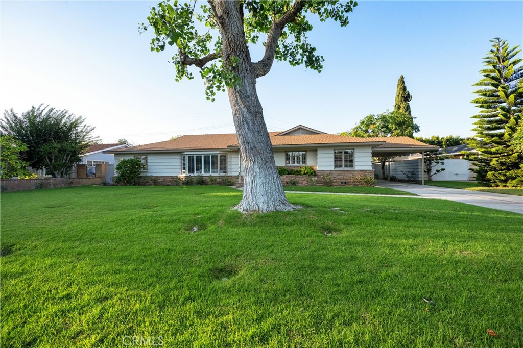 For the very first time, this single-family-owned home is being offered in the heart of the sought-after Fisher Park neighborhood. Built in 1955, 1101 Sharon Road is a beautifully preserved custom ranch-style home that captures the charm and warmth of a bygone era — when the surrounding landscape still held mature walnut groves and quiet, tree-lined streets. From the moment you arrive, the curved walkway and vintage lamppost greet you with timeless character. Step past the blooming geraniums and into a home that tells a story — starting with a spacious living room featuring a iconic bay picture window, refinished original Red oak hardwood floors, and plantation shutters throughout. Light pours in through wall-to-wall windows in the open family and dining rooms, offering serene views of the sparkling pool and patio — perfect for entertaining or simply unwinding. This approximately 2,800 sq ft home offers 5 bedrooms and 3.5 baths, all set on a generous, extra-wide double lot. You’ll find charming original features throughout: a large stone fireplace, built-in bookshelves, clever hallway cupboards and drawers, and bathrooms showcasing mid-century tile work that has stood the test of time.
An addition built in 1967 created even more flexible living space, ideal for guest rooms, extended family, a home office, or creative studio. The kitchen, with its cozy eat-in nook, connects easily to the side porte cochere entry and a convenient inside laundry area. Step outside to a gated, rose-lined pool area, with a small gate that opens into a separate garden or recreation space — your own private retreat. A long driveway leads to a detached two-car garage, plus space for 4+ additional vehicles. Located in a community full of heart, you'll love being near Jack
Fisher Park and part of the vibrant West Floral and Historic Floral Park neighborhoods — known for their friendly spirit and events like ice cream socials, garden swaps, and holiday events. Here, neighbors still take evening strolls and greet each other with a smile. Whether you're looking to preserve the mid-century charm or add your own personal touches, this home offers endless potential — and may even qualify for Mills Act historic designation benefits. Come see what makes Sharon Road such a special place to call home. We can’t wait to welcome you.