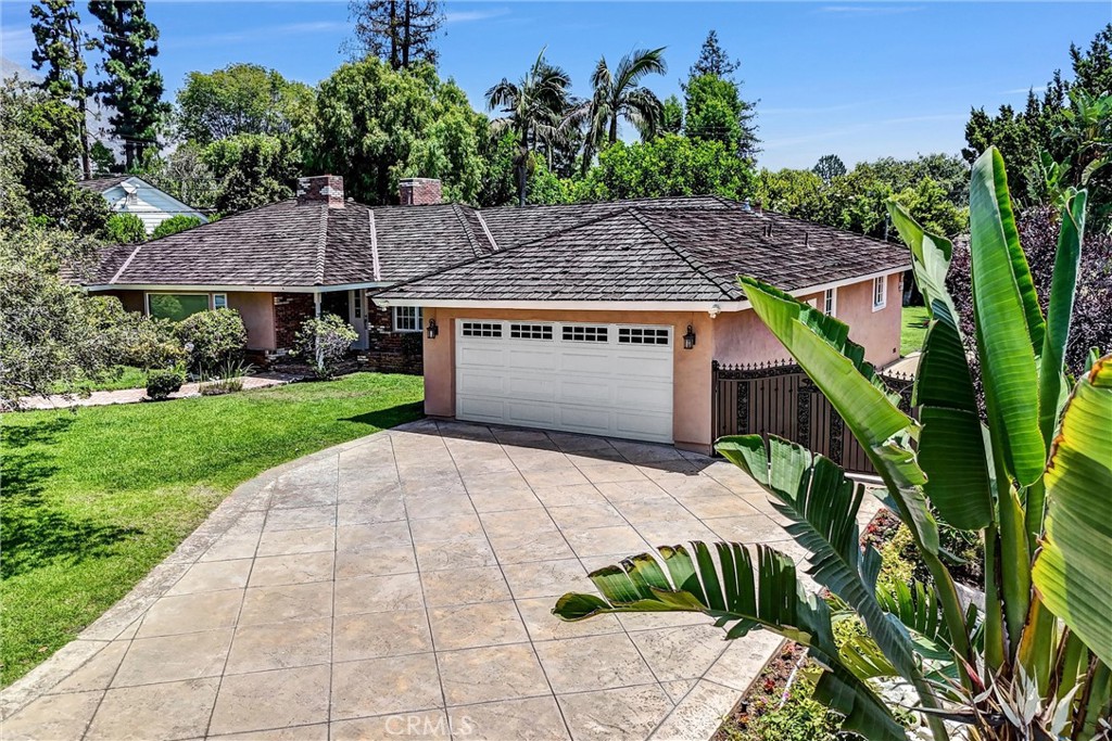 Welcome to this adorable single story home in North Arcadia's MOST prestigious neighborhood-Upper Rancho-now available for an Honest-To-God reasonable price. Sitting on a 16,652 sq ft lot, this custom built home offers 4 generously sized bedrooms and 3 luxurious bathrooms across approximately 3000 square feet of refined living space designed for both comfort and grandeur. Upon entry you are greeted by a spacious living room with a unique fireplace and elegant finishes setting the tone for the sophistication throughout. Grand living room flows seamlessly into the elegant formal dining room with a magnificent crystal chandelier and a warm and inviting family room featuring another custom fireplace and French doors that enhance natural light and indoor-outdoor flow, all perfect for entertaining and family gatherings. The open-concept kitchen is a chef's dream equipped with extensive cherry-wood cabinetry, professional grade appliances, granite countertops, a large center island and a bright breakfast area. Step outside into a true backyard oasis-complete with stone walkways, colorful plant life, mature Palm and Pine trees, lush, landscaped greens kidney-shaped pool and spa-ideal for relaxing, entertaining, or family fun. Additional highlights include excellent natural light throughout, a Master Bedroom with Jacuzzi and French doors that open to its own patio wood deck and a thoughtfully designed layout ideal for comfortable family living and grand scale entertaining. Don't miss this rare opportunity to own this exquisite home in North Arcadia's most desirable haven-Upper Rancho.
